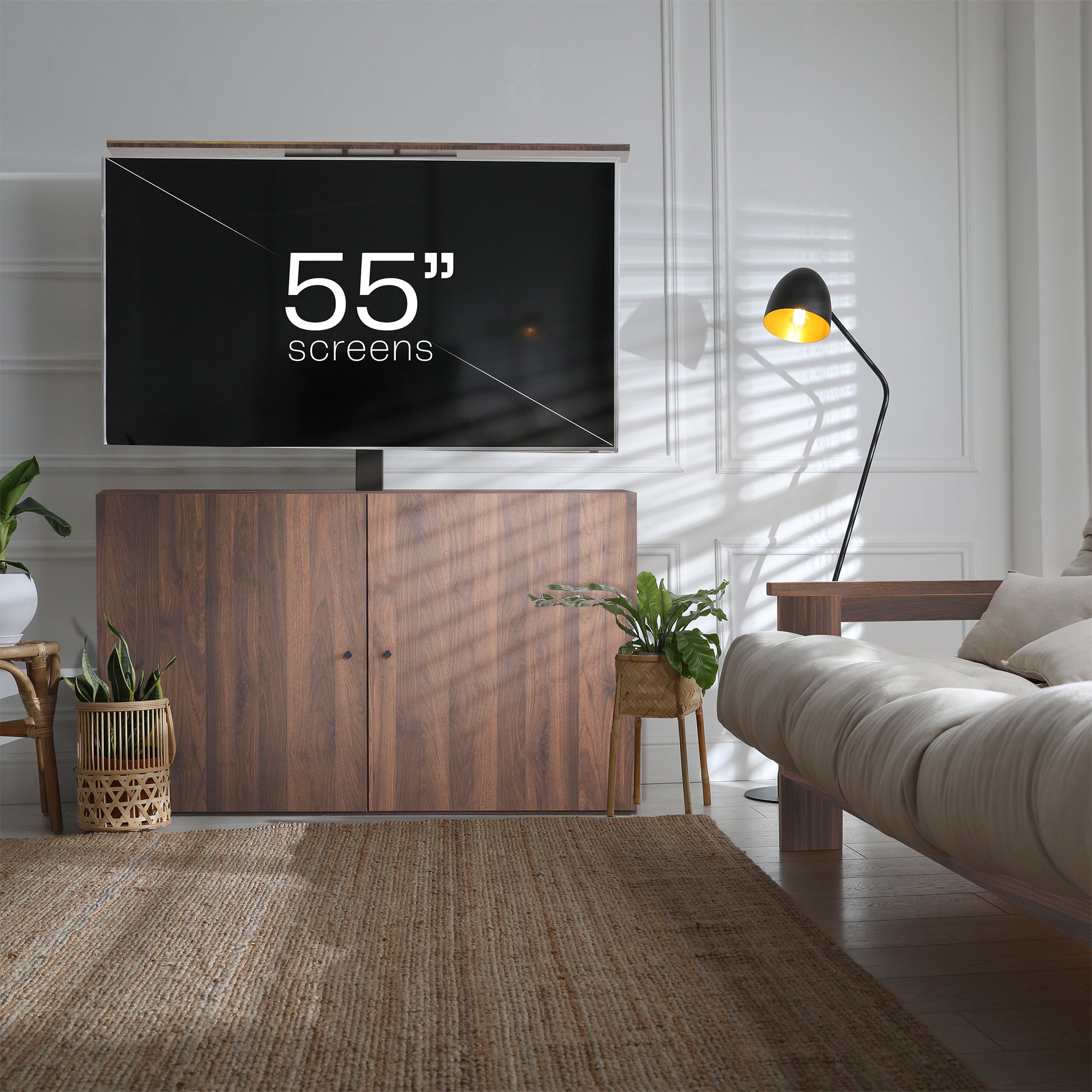 A walnut brown TV lift cabinet with a flat-screen TV mounted on top in a modern living room.