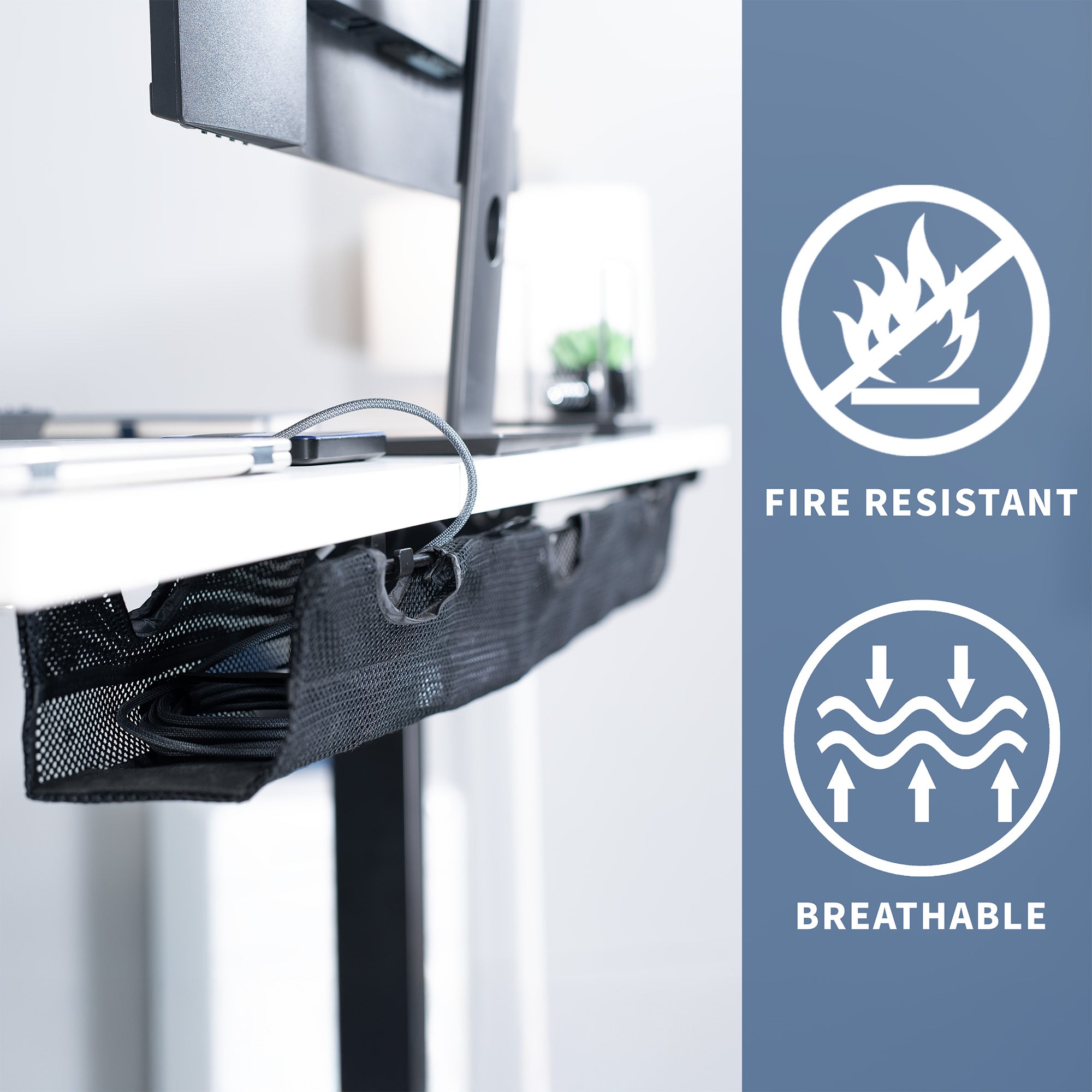 A black mesh cable management system under a white desk with icons to the right with text displaying fire resistant and breathable design.