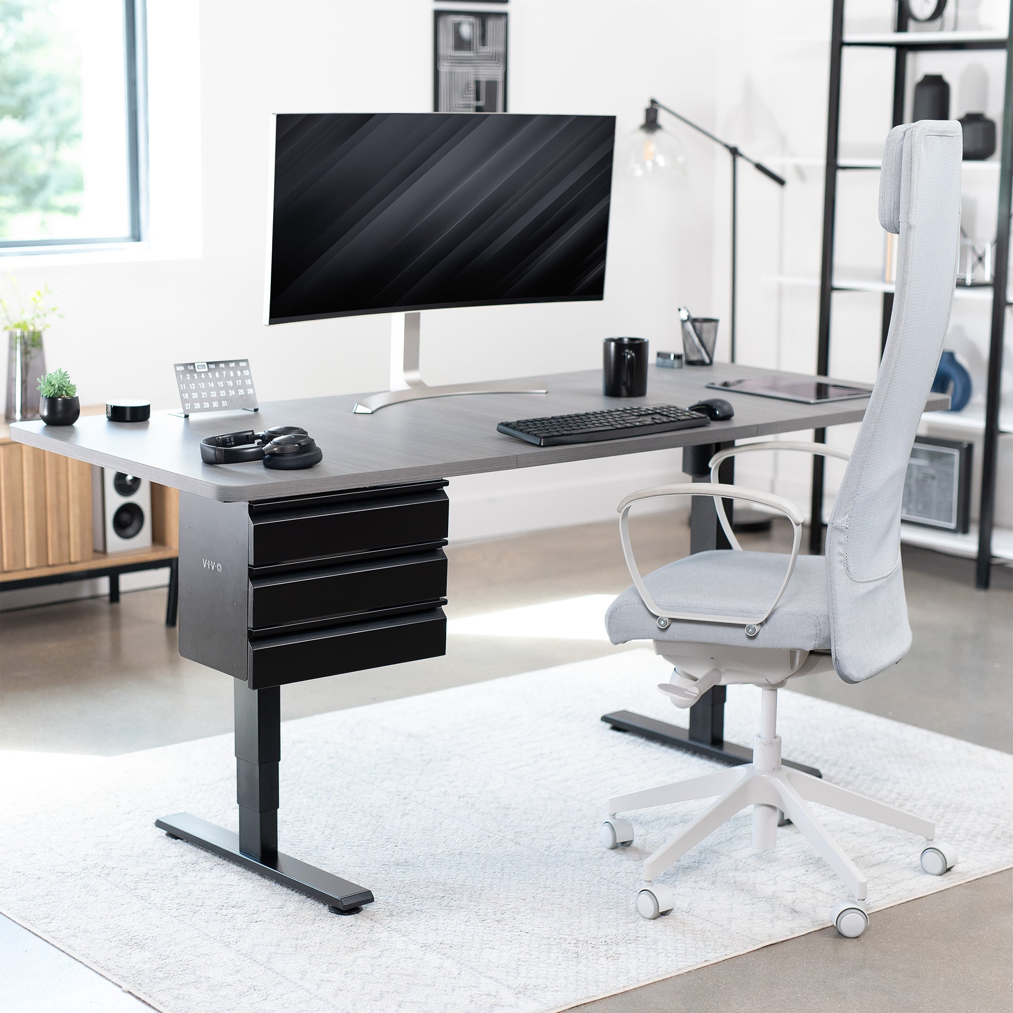 Sleek under desk storage unit with three pull-out drawers for office workstation organization.