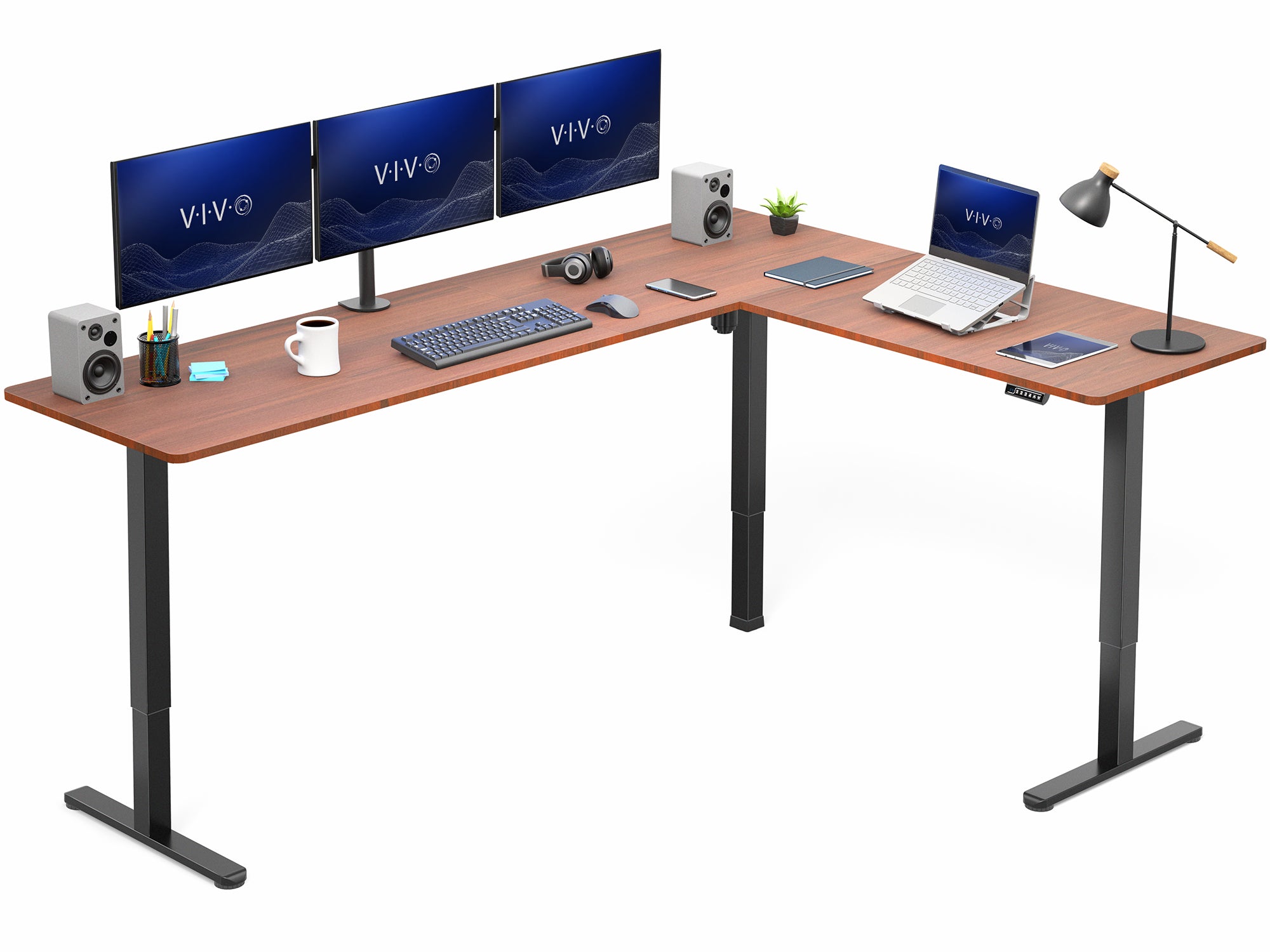 L-shaped desk setup with multiple monitors, a laptop, and office accessories on a white background.