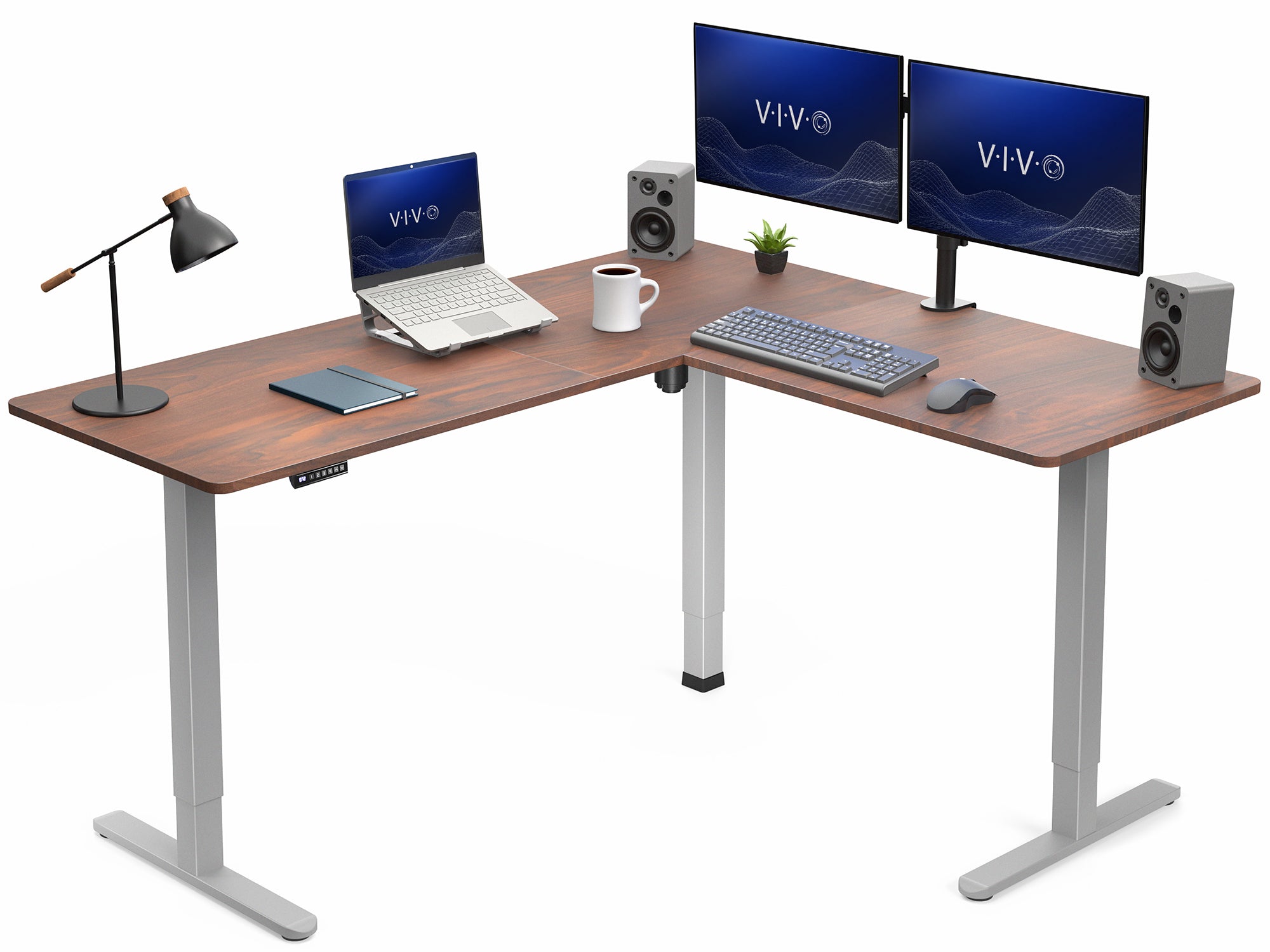L-shaped desk with computer setup including monitors, keyboard, and speakers on a white background