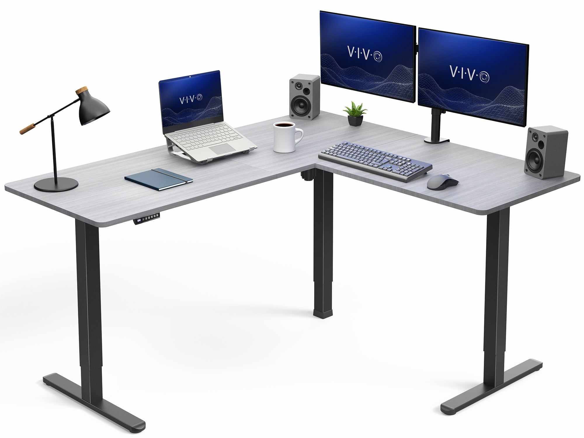 L-shaped desk with computer setup including monitors, laptop, and office items on a white background