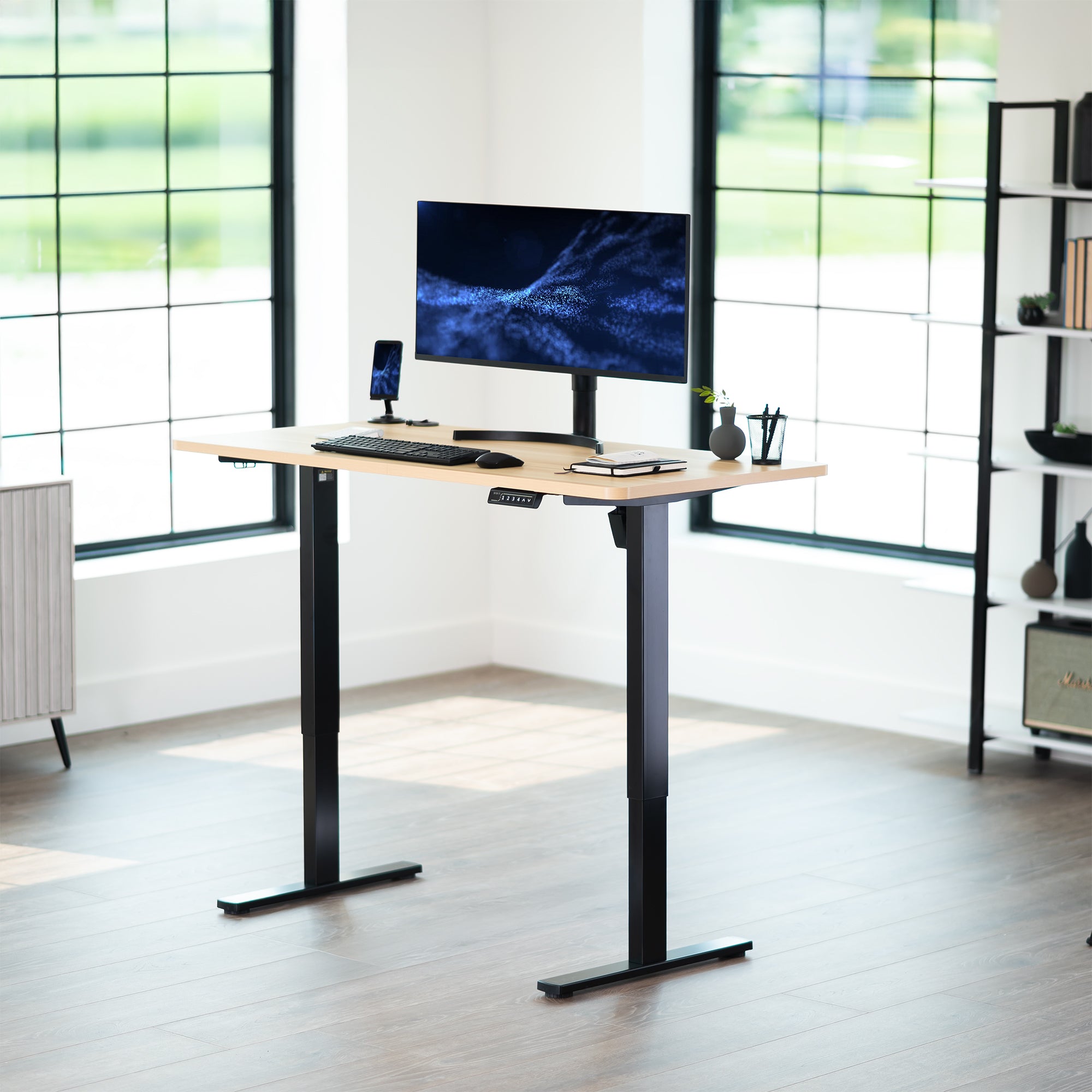 Sturdy ergonomic sit or stand active desk workstation with adjustable height using smart control panel.