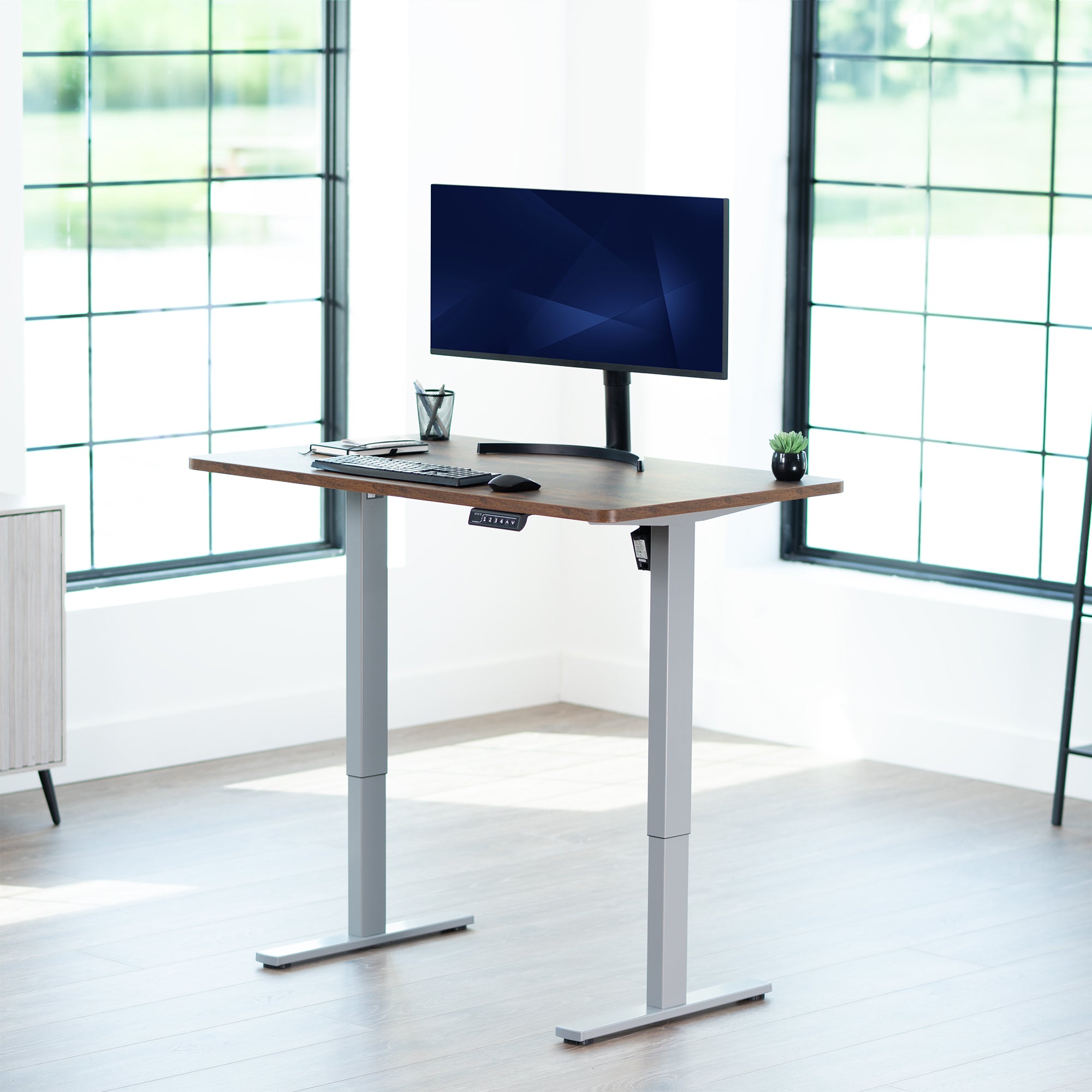 Sturdy ergonomic sit or stand active desk workstation with adjustable height using smart control panel.