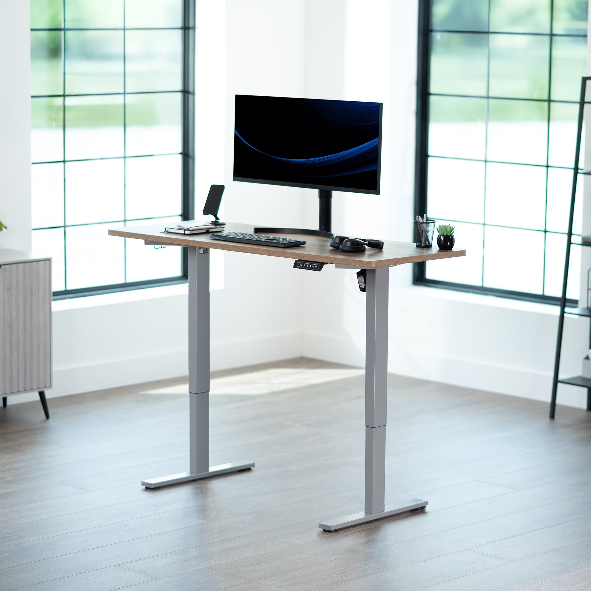 Sturdy ergonomic sit or stand active desk workstation with adjustable height using smart control panel.