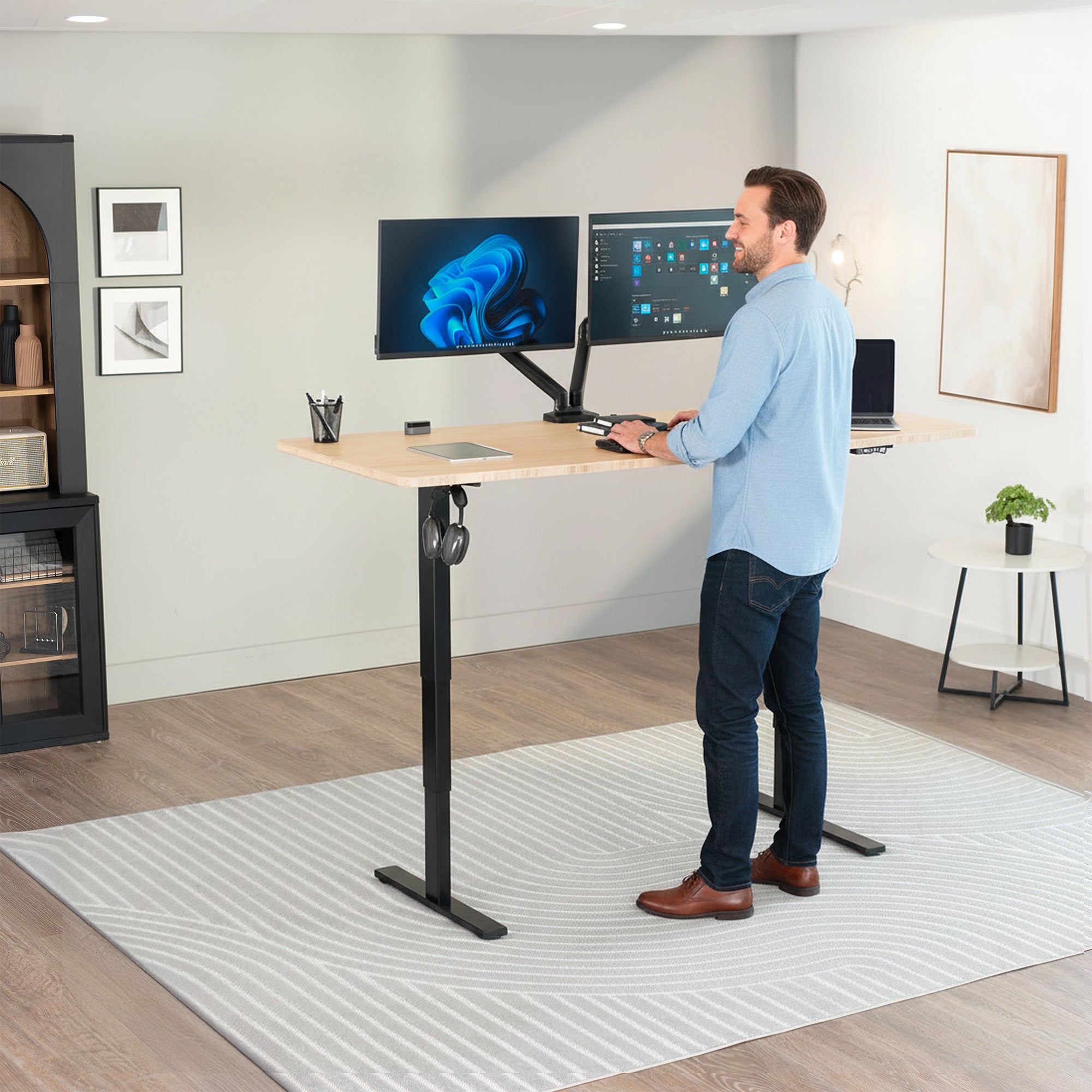 Heavy-duty electric height adjustable desktop workstation for active sit or stand efficient workspace.