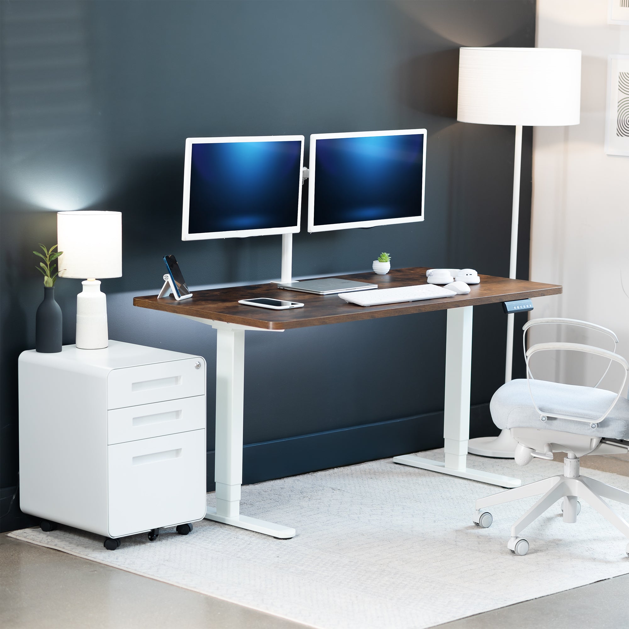 Modern office setup with a desk, two monitors, and office chair.