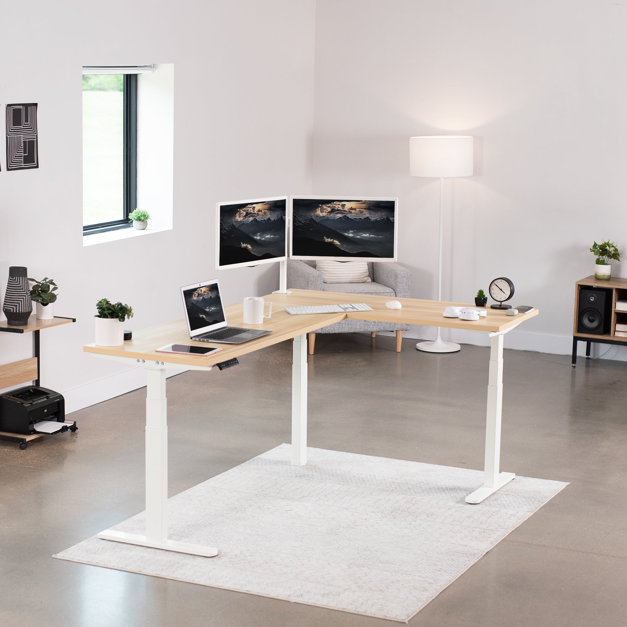 Large electric heavy-duty corner desk workstation for modern office workspaces.