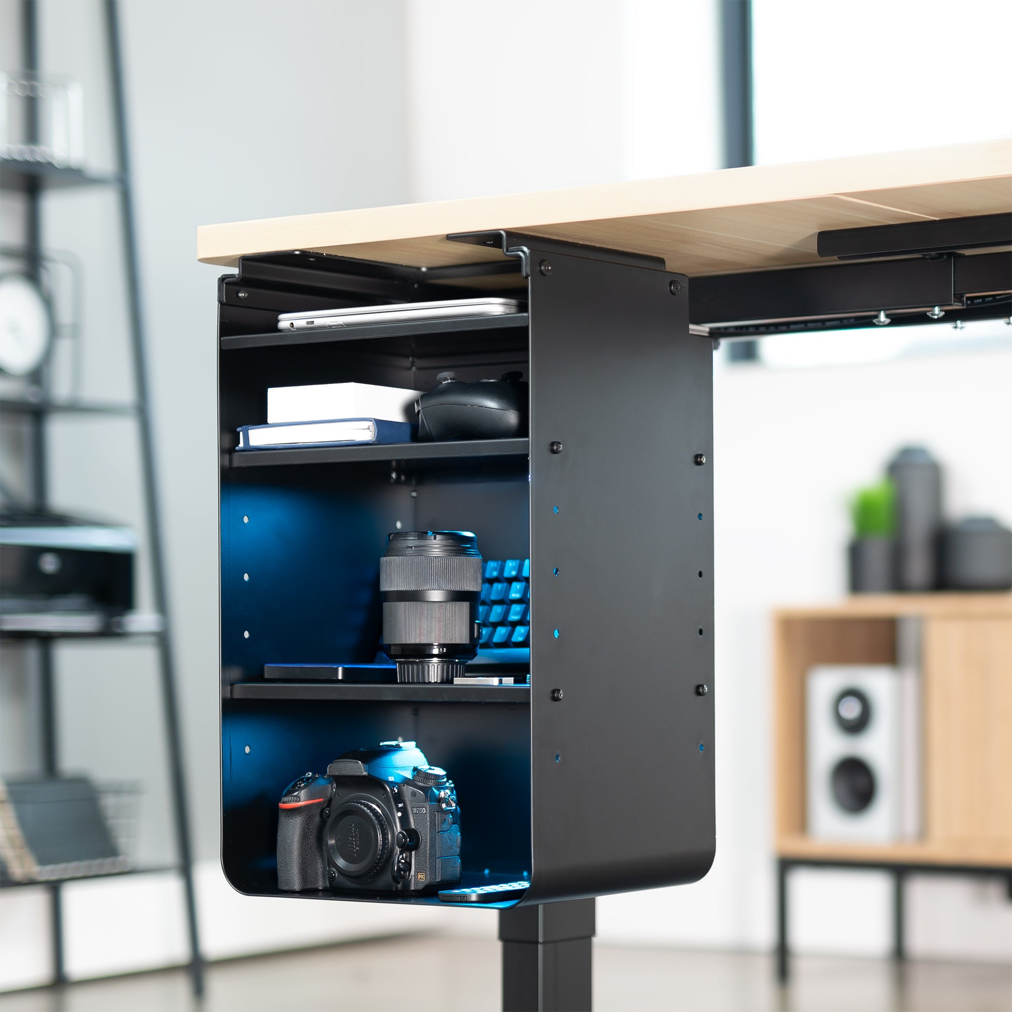 An under desk black shelving unit with multiple shelves in a modern office.