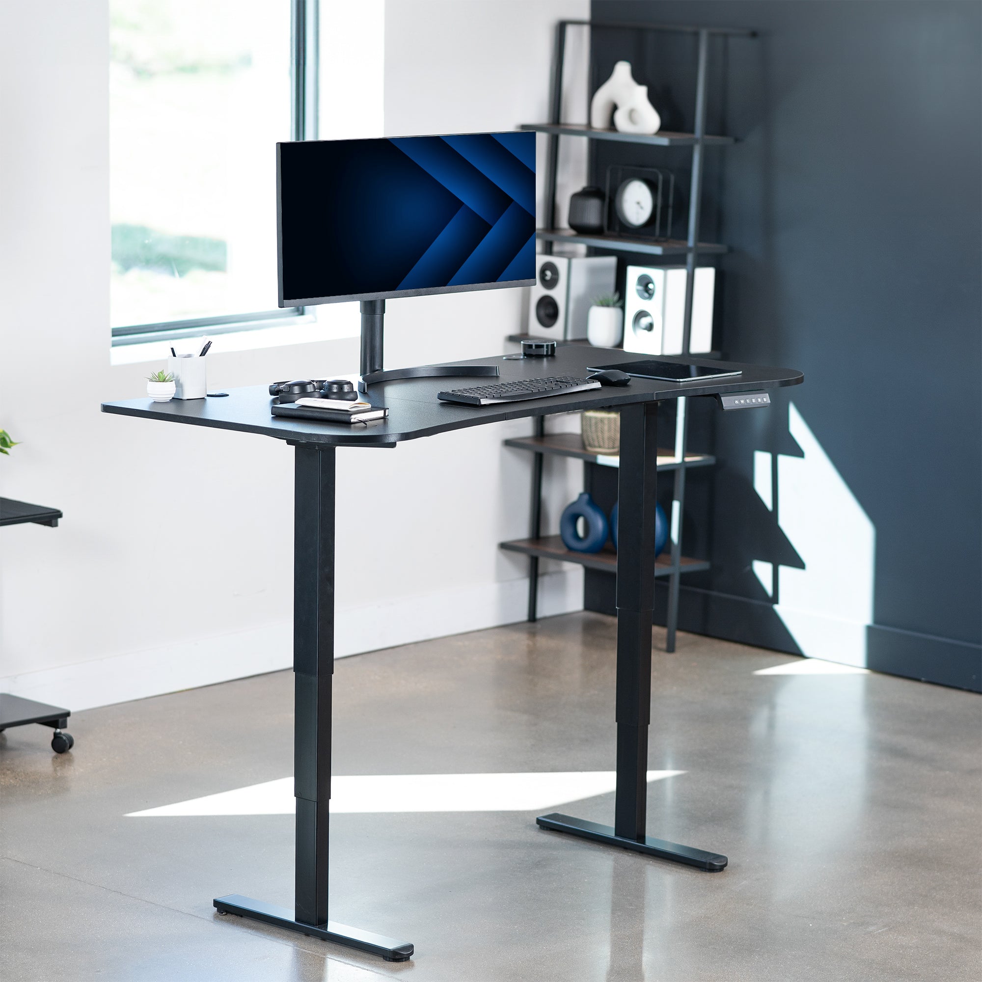 Advanced modern desktop that comes in three panels placed on electric desk frame.