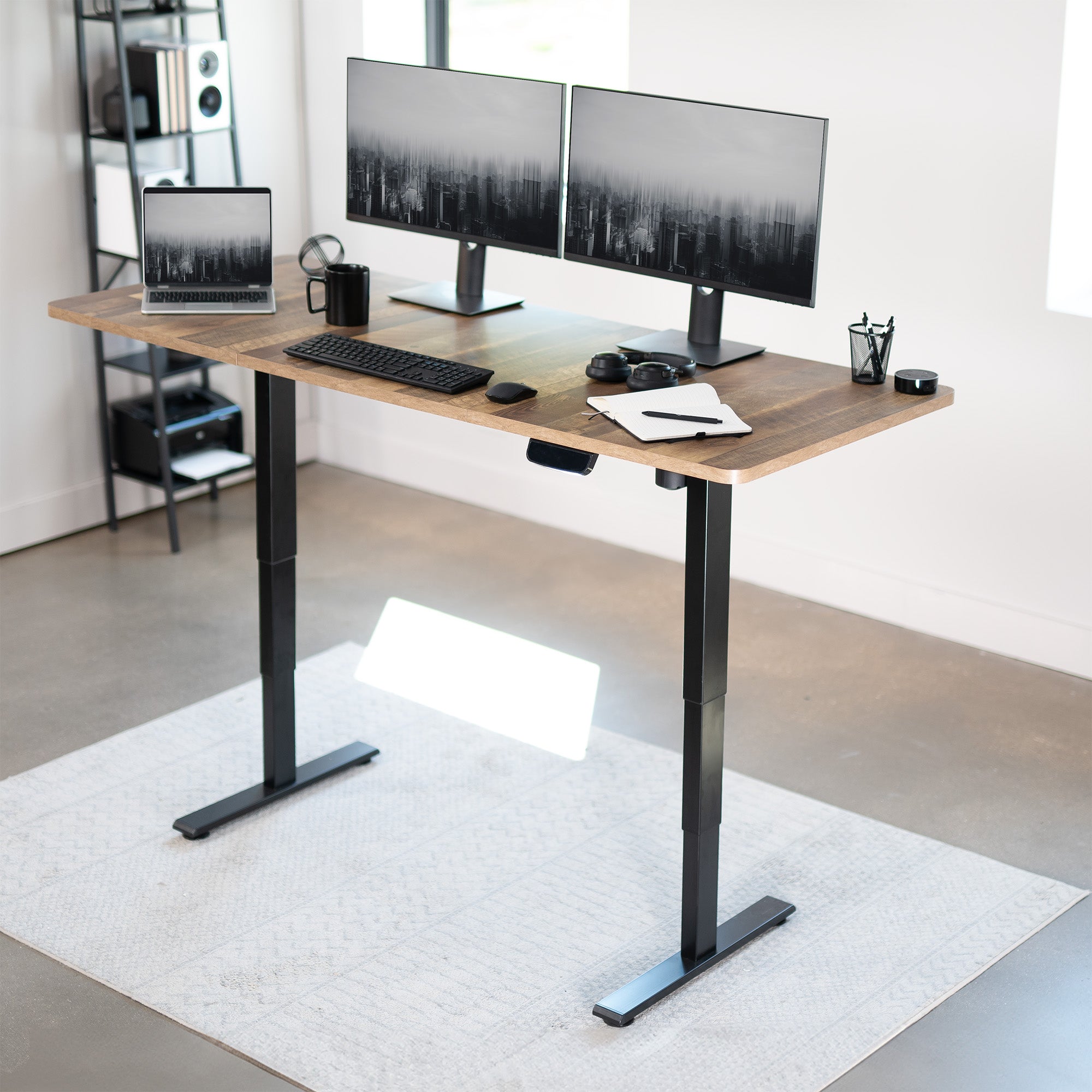 Durable sit to stand desk rustic tabletop workstation with wide surface space.