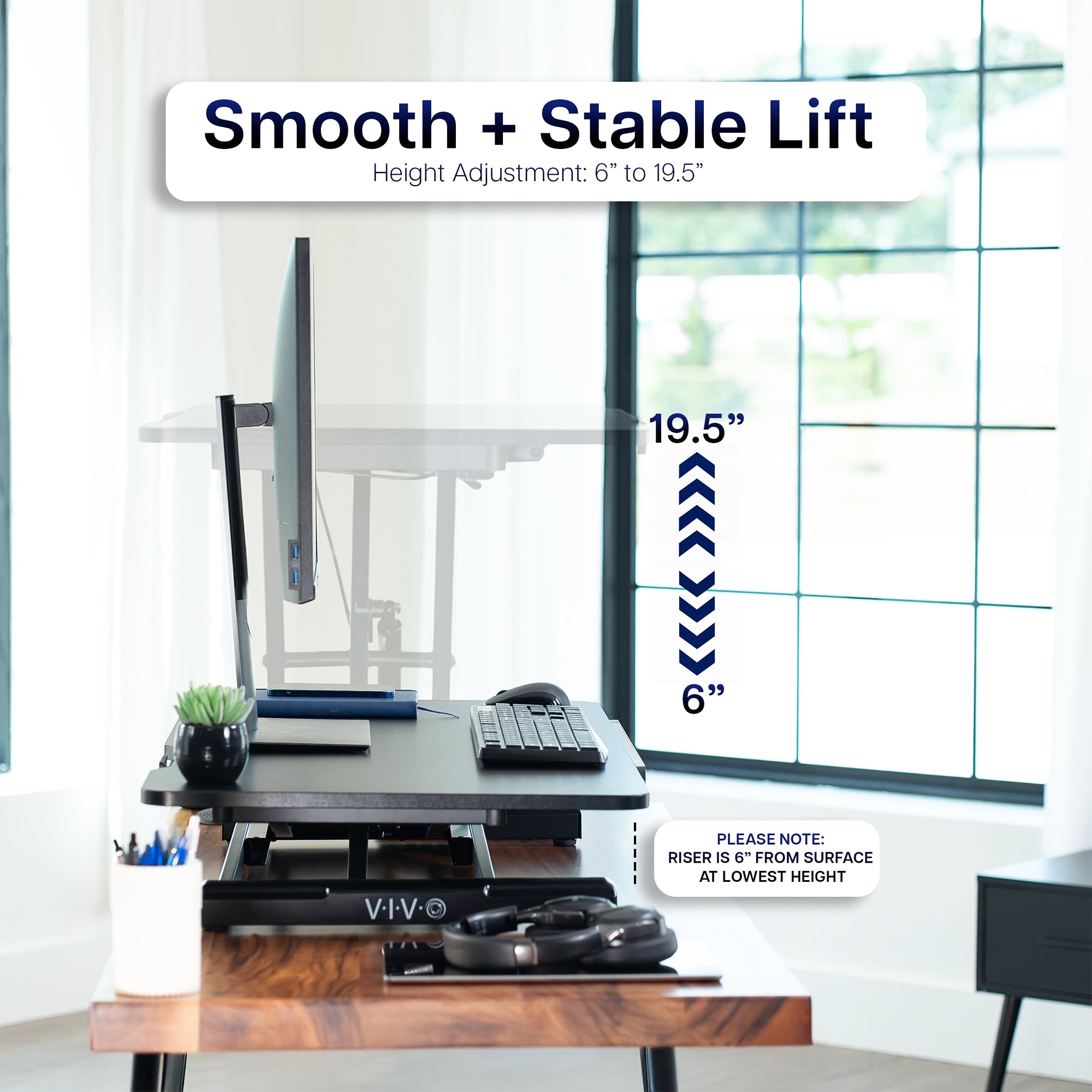 Adjustable desk with smooth and stable lift feature, showing height adjustment range.