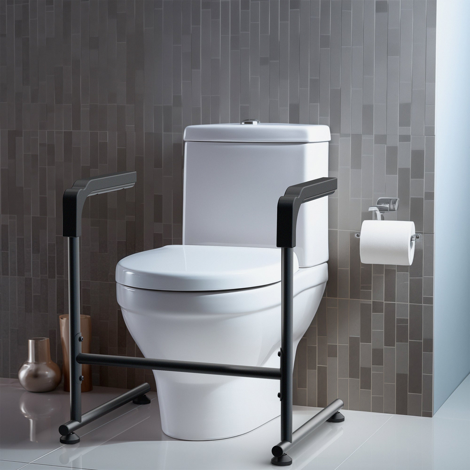 White toilet with a black stand assist frame against a gray tiled wall.
