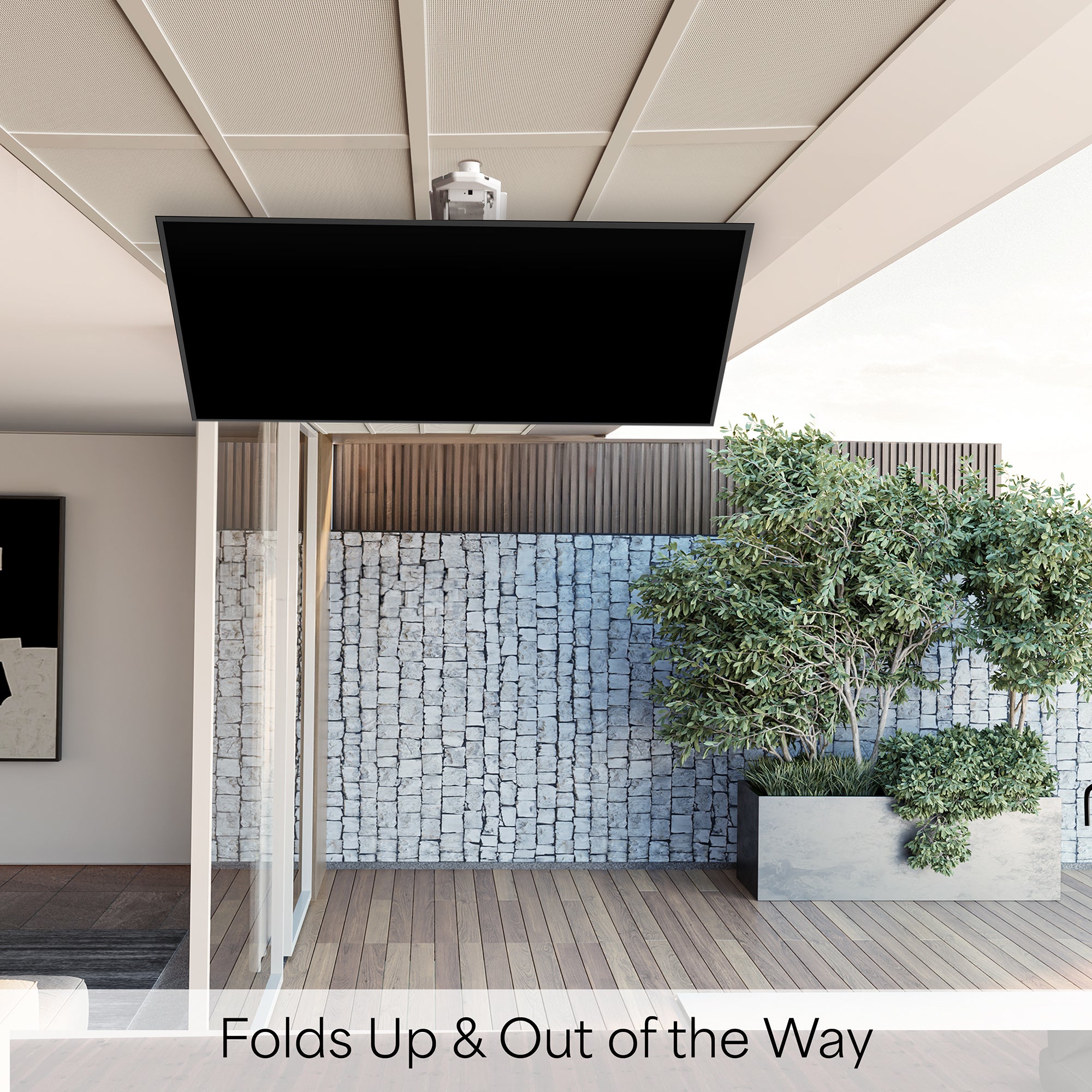 Ceiling-mounted screen or TV with a stone wall and plants in the background