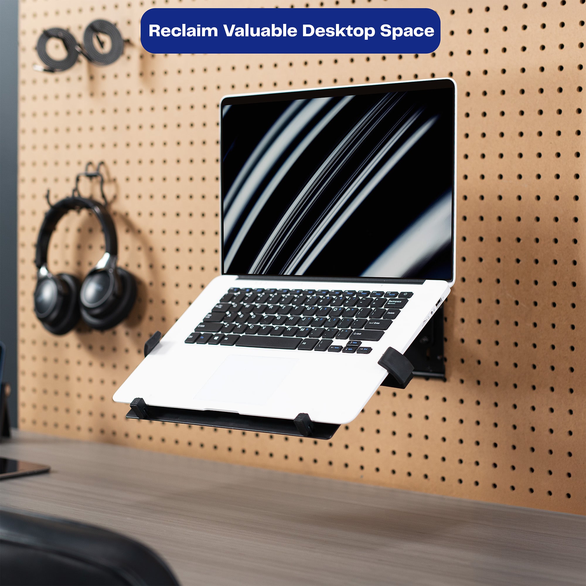 Pegboard mounted laptop tray with articulating arm. Featuring adjustable holder clamps and tray ventilation.