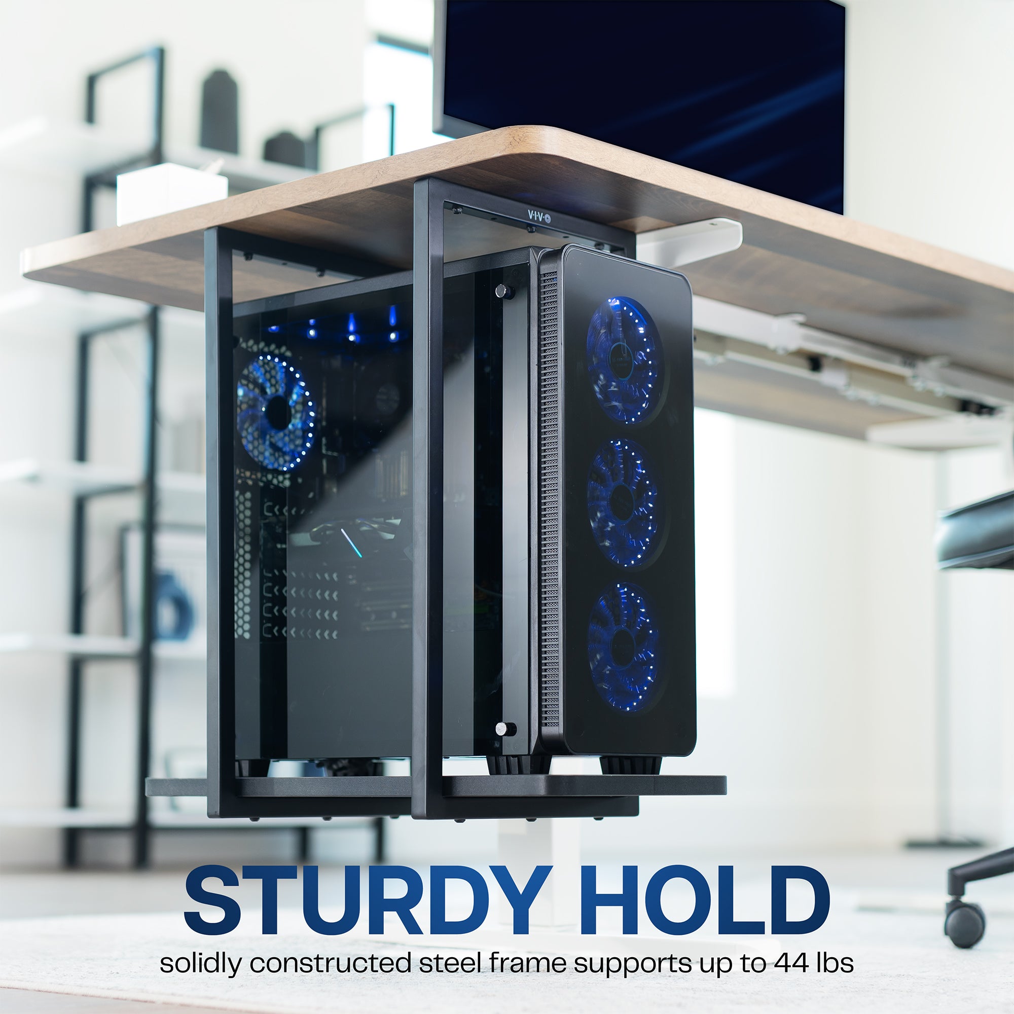 Computer tower with blue LED fans on a desk in an office setting, with text.