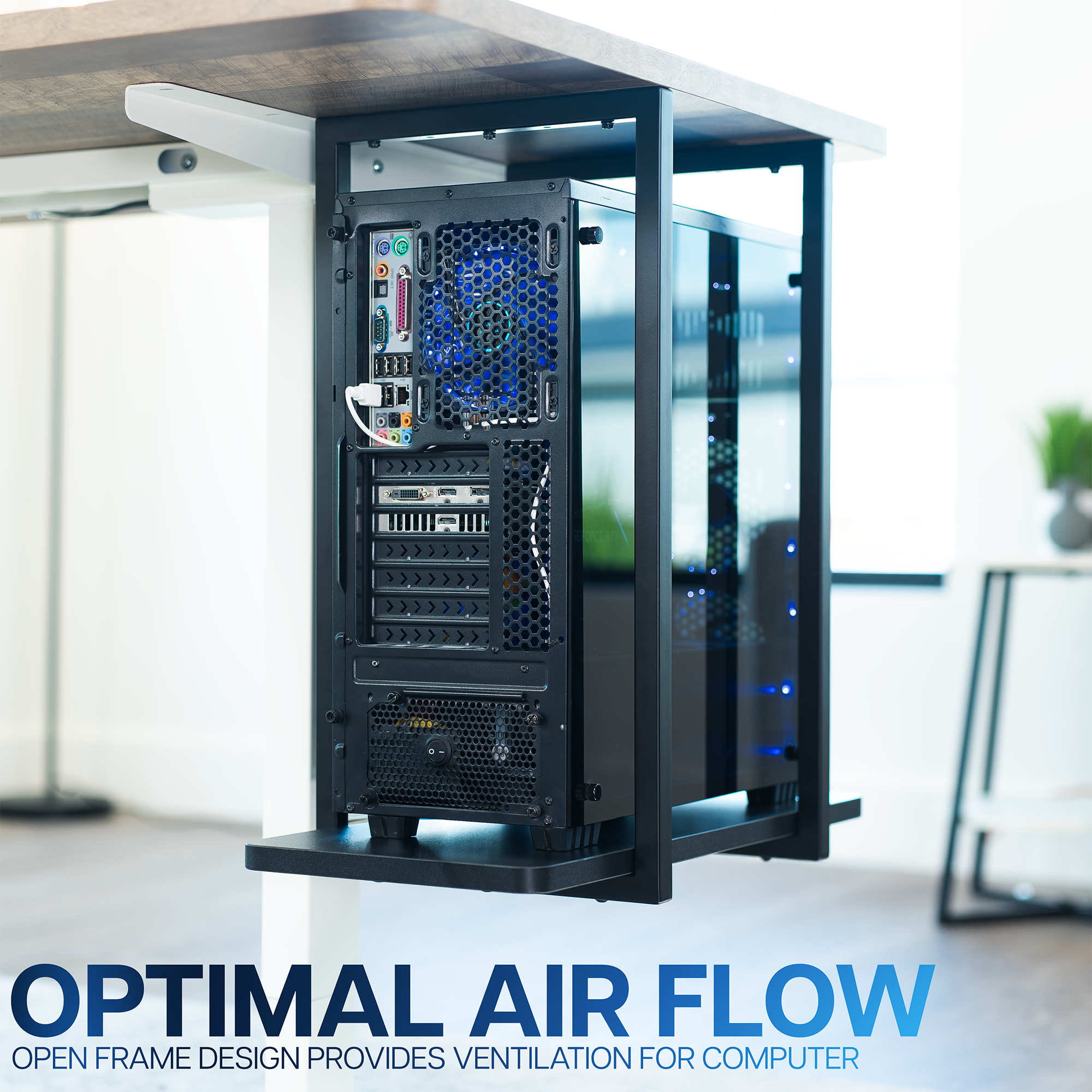 Computer tower with open frame design on a desk.