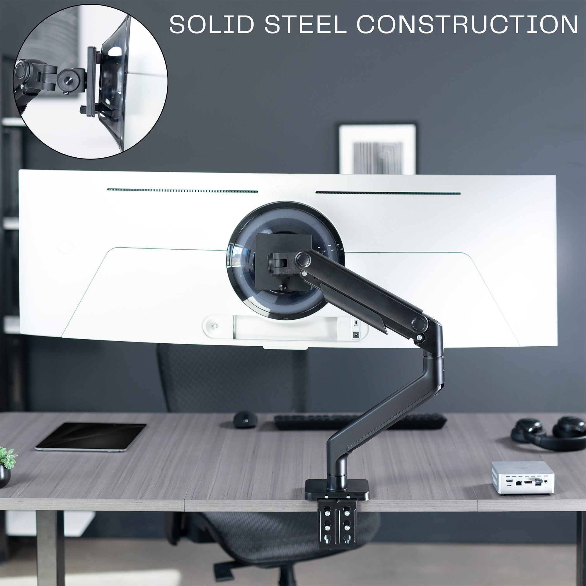 A black VESA adapter designed for a Samsung OLED G9 monitor.