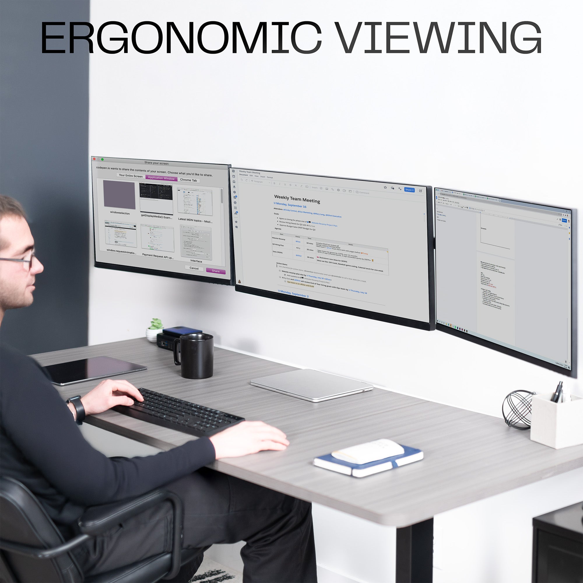 A black telescoping triple monitor wall mount with adjustable arms for mounting multiple screens.
