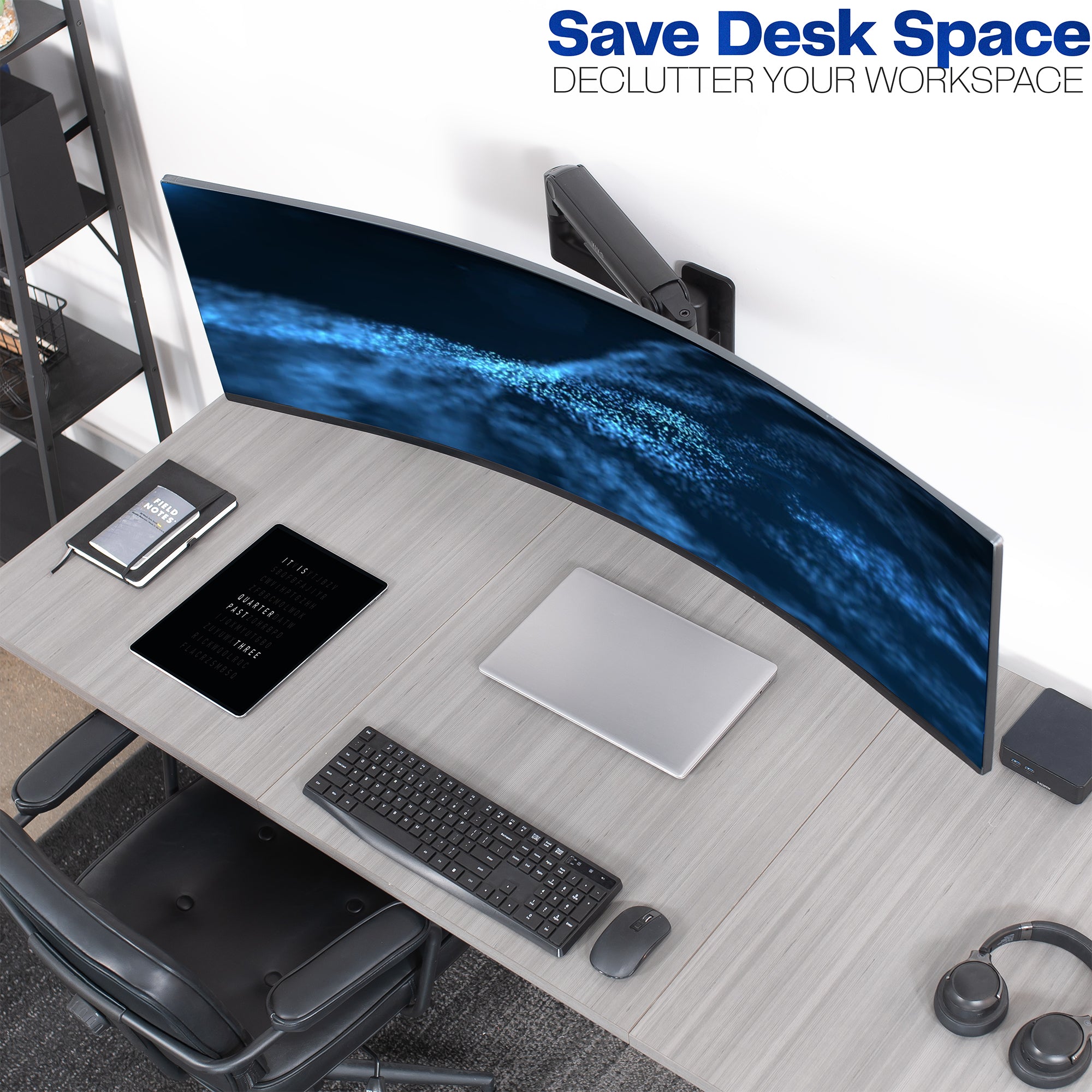 A single ultrawide computer monitor attached to a pneumatic arm wall mount displaying an organized desk space.