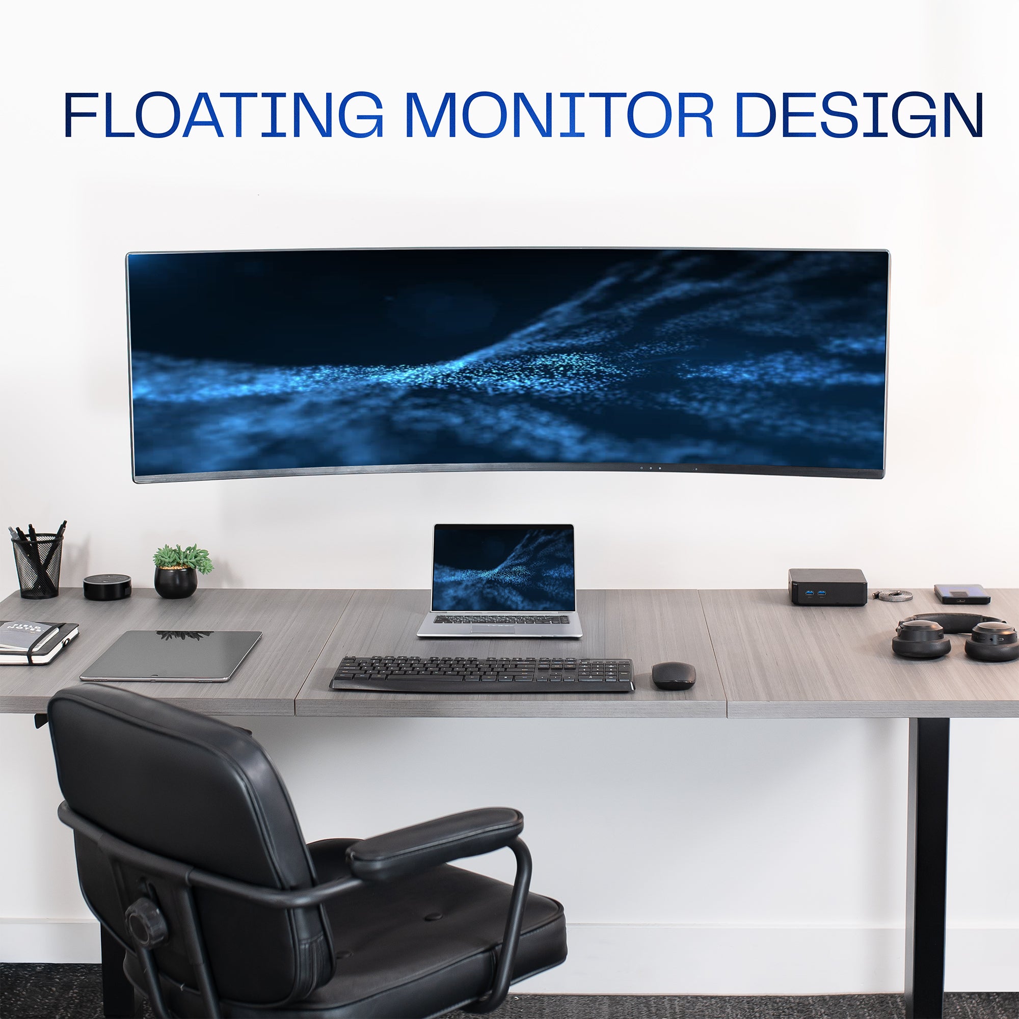 A single ultrawide computer monitor attached to a pneumatic arm wall mount in an office setting with a floating monitor design.