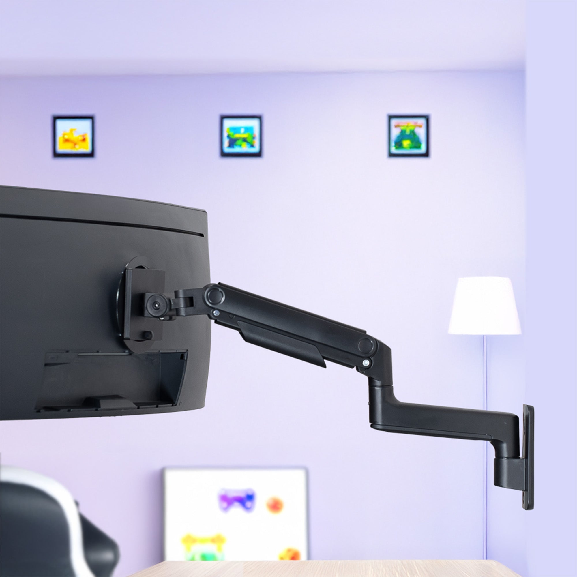 A single ultrawide computer monitor attached to a pneumatic arm wall mount in a home office setting.