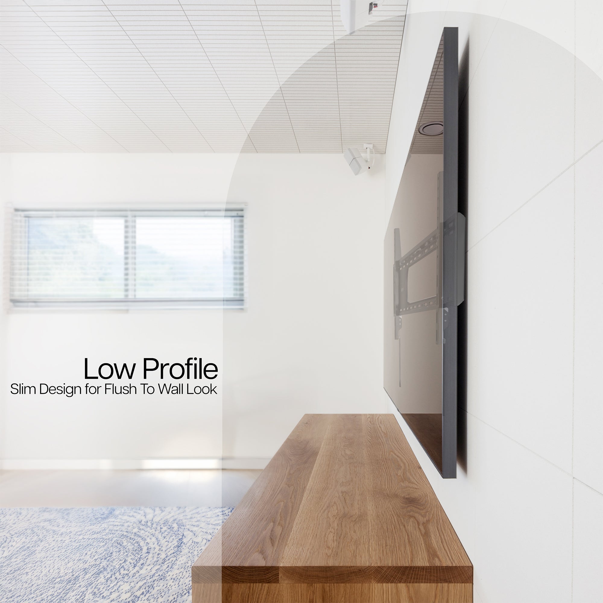 A black TV wall mount with text showing low profile design.