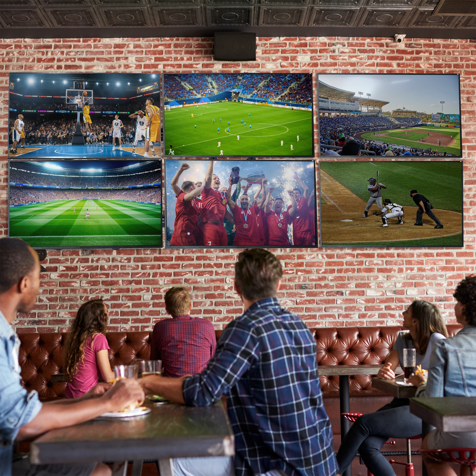 A set of black video wall mounts designed to support multiple TVs in a restaurant setting.