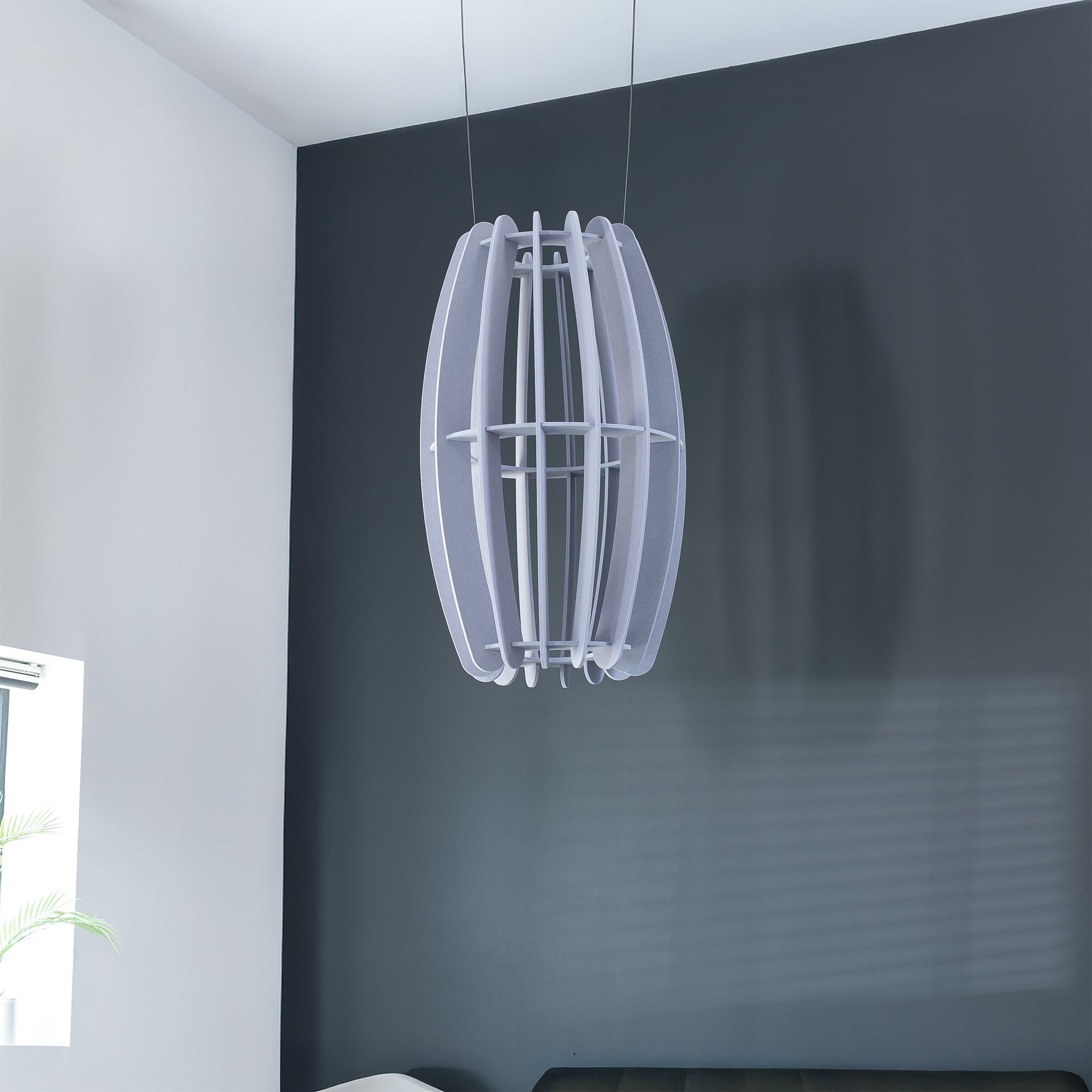 A large oval-shaped acoustic ceiling sound absorber in a light gray color, designed to be suspended from the ceiling.