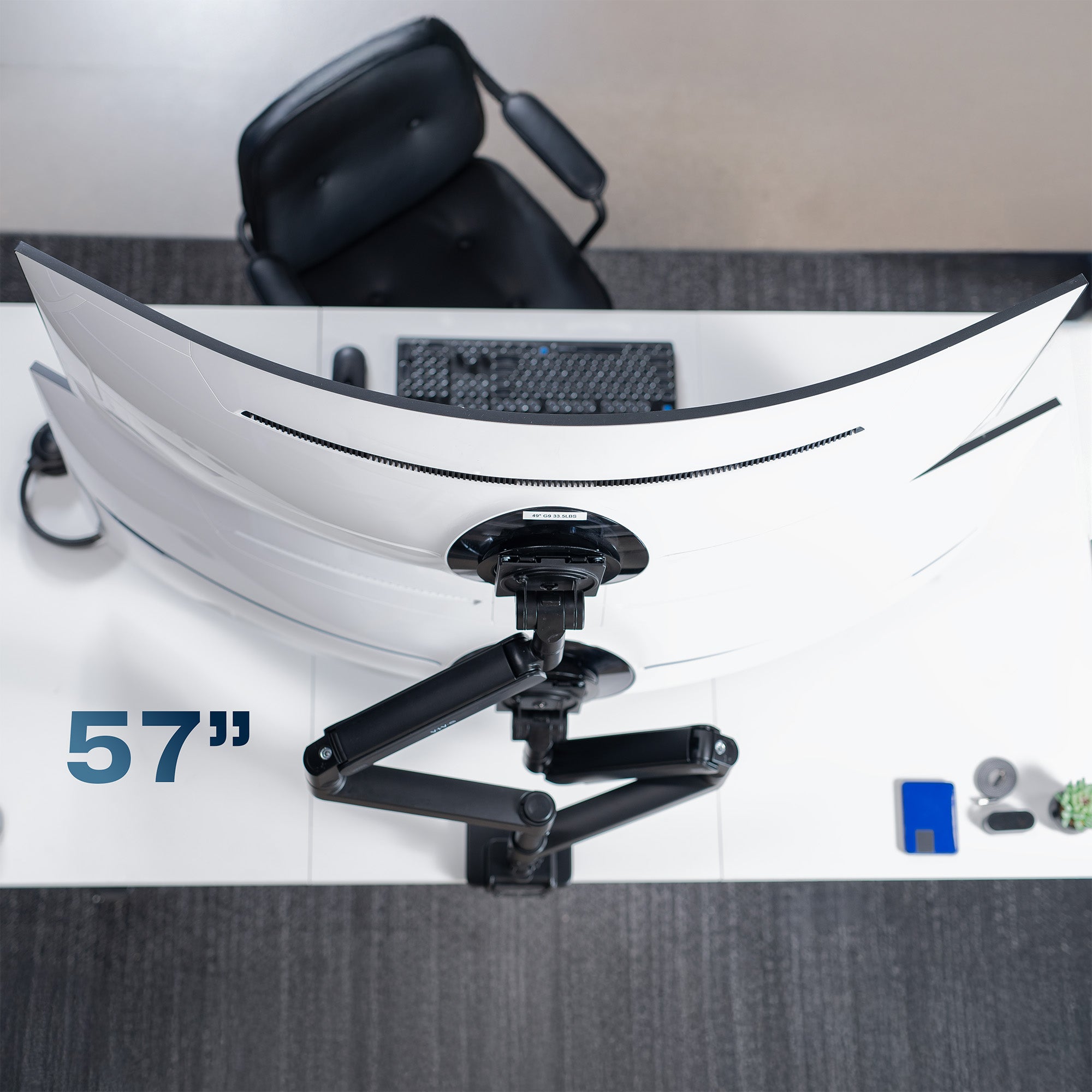 A dual monitor desk mount with pneumatic arms.