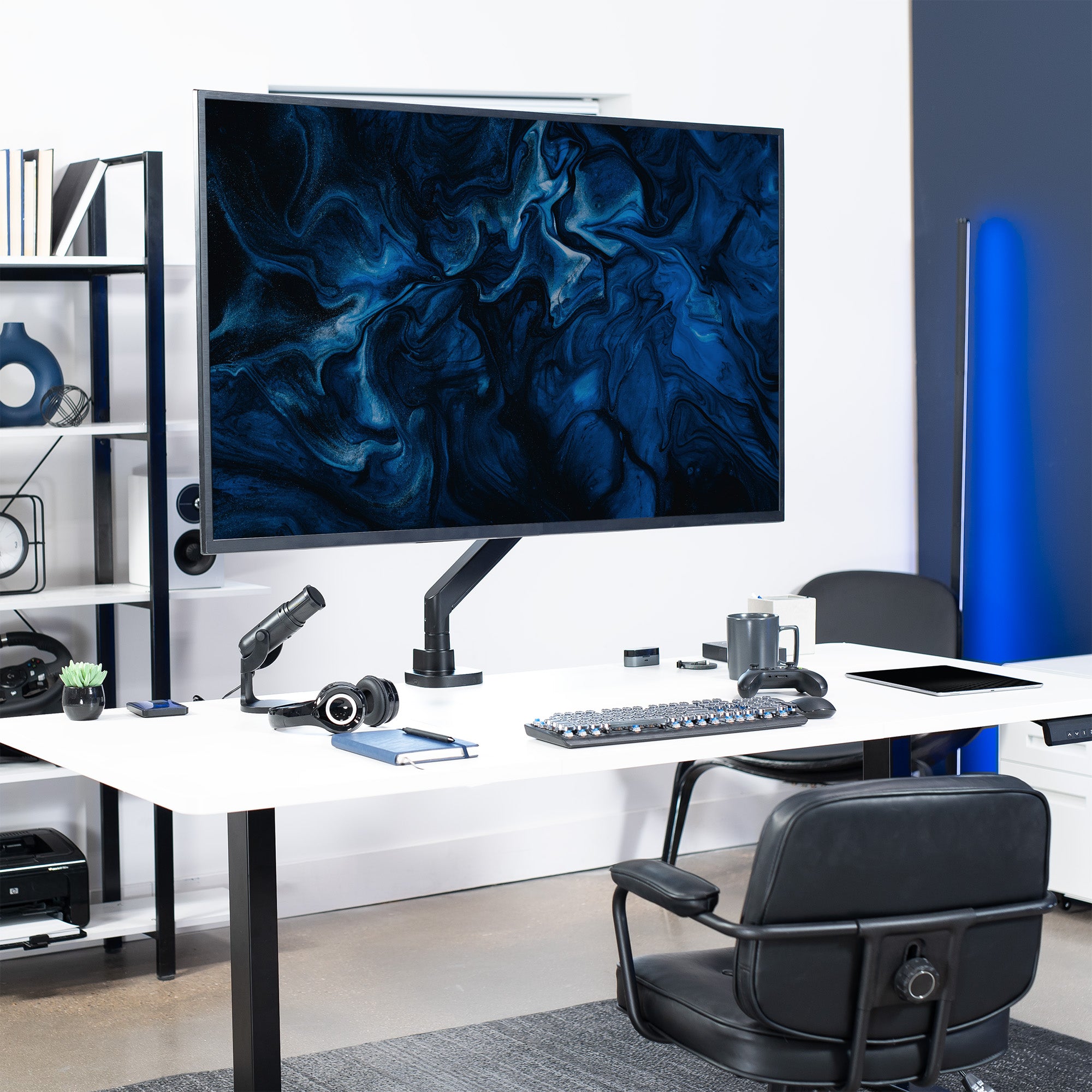 Monitor with an adjustable arm in a modern home office setting.