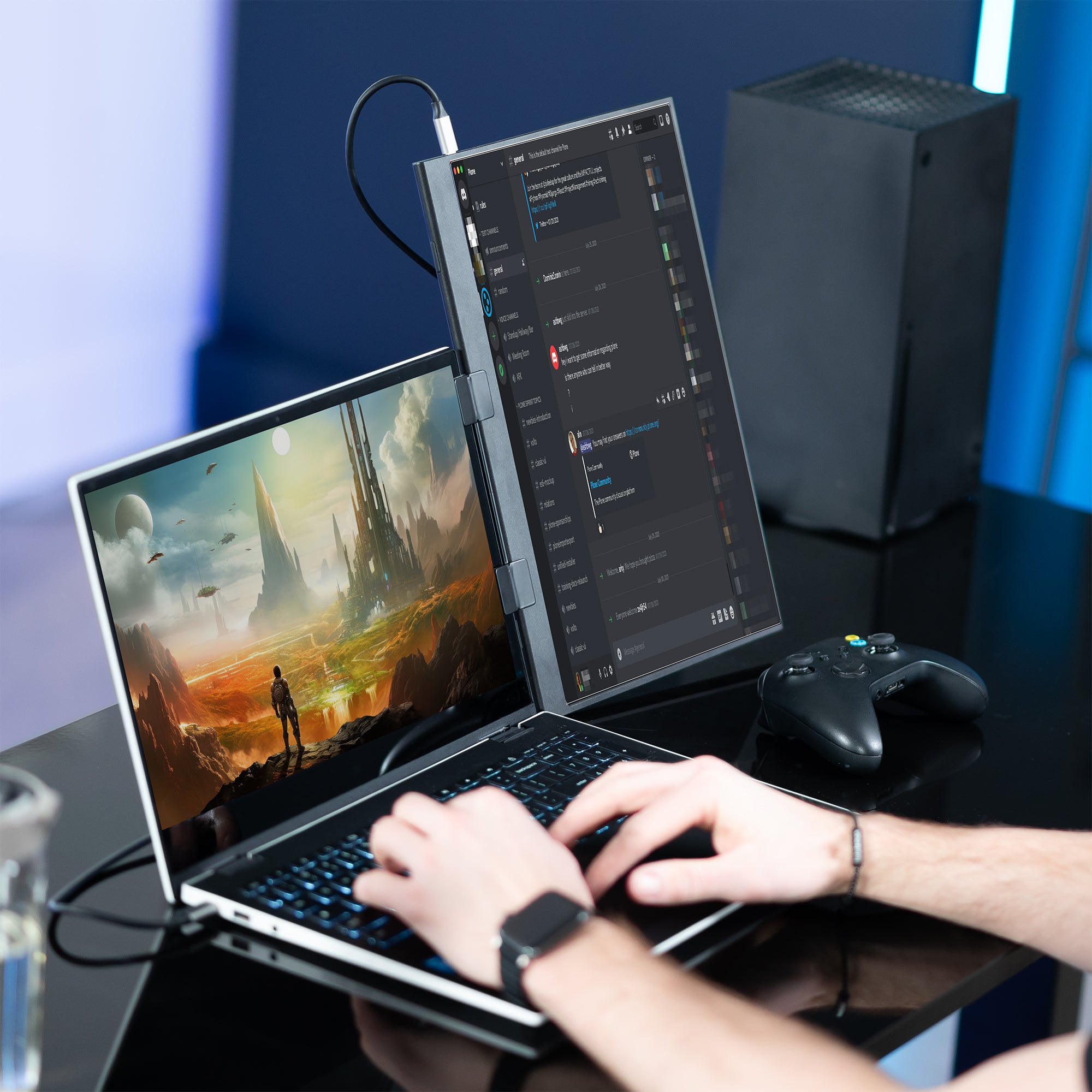 A black portable monitor laptop extension holder with a person playing a game on the laptop