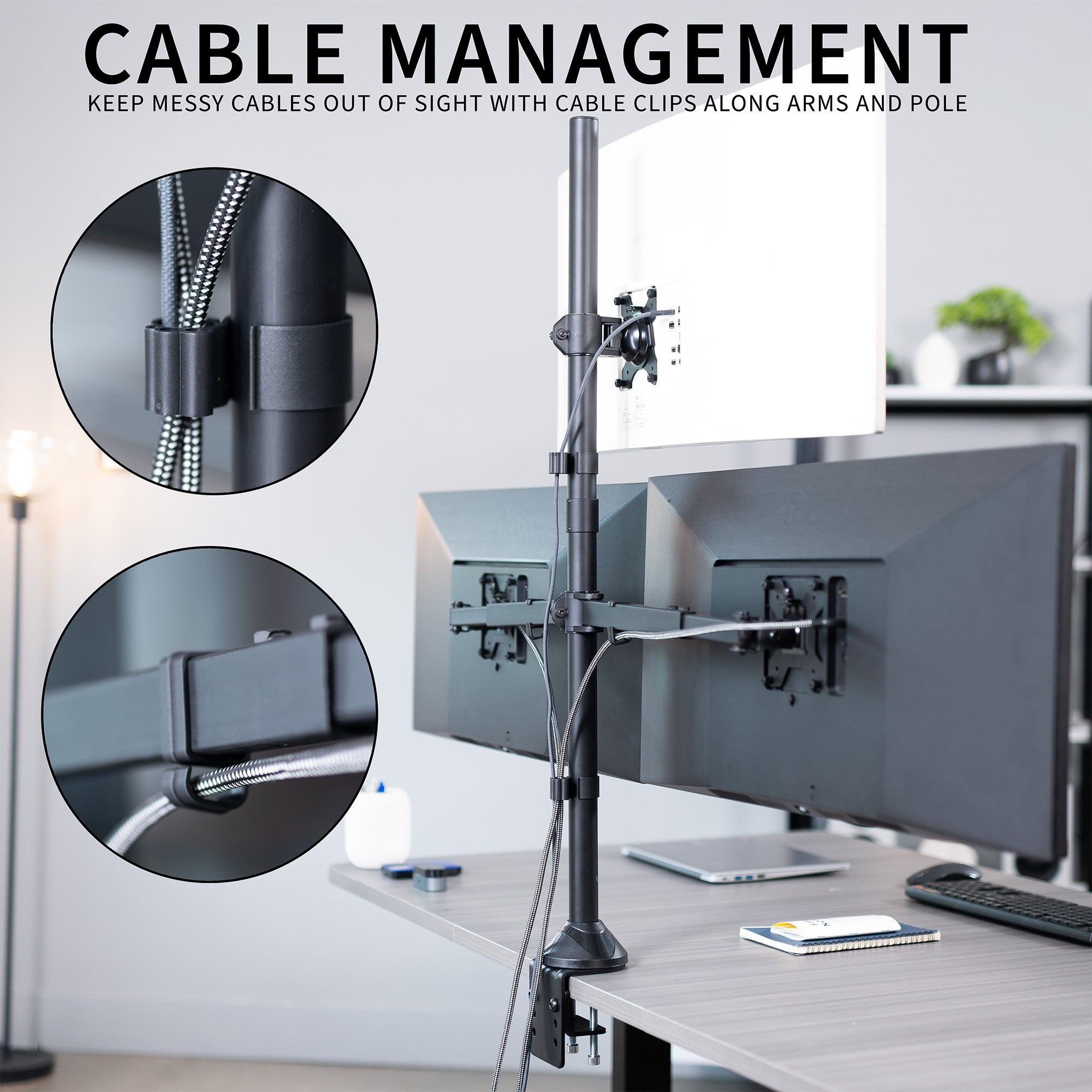 Desk setup with cable management system featuring cable clips and monitors.