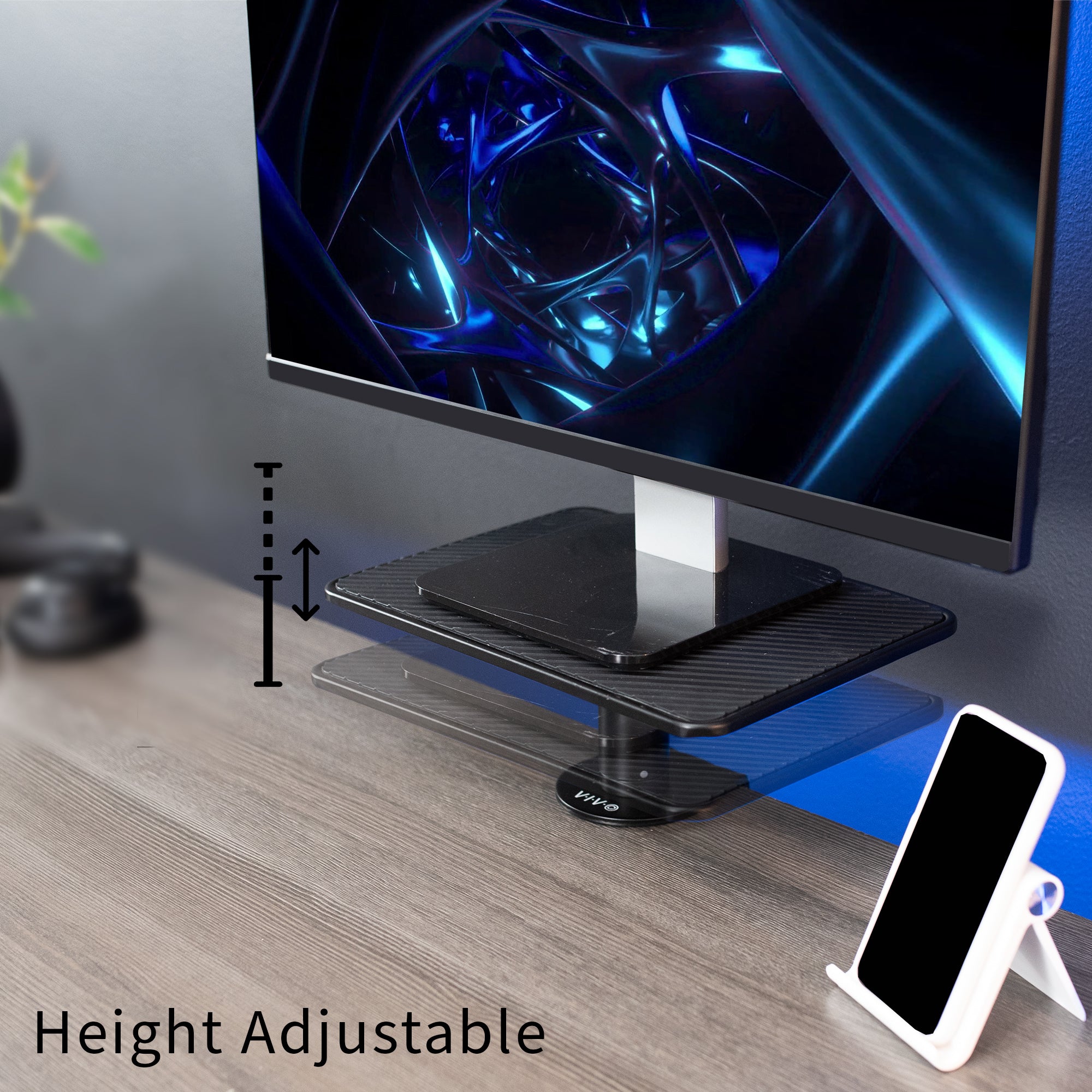 Height adjustable monitor stand with a computer monitor on a desk