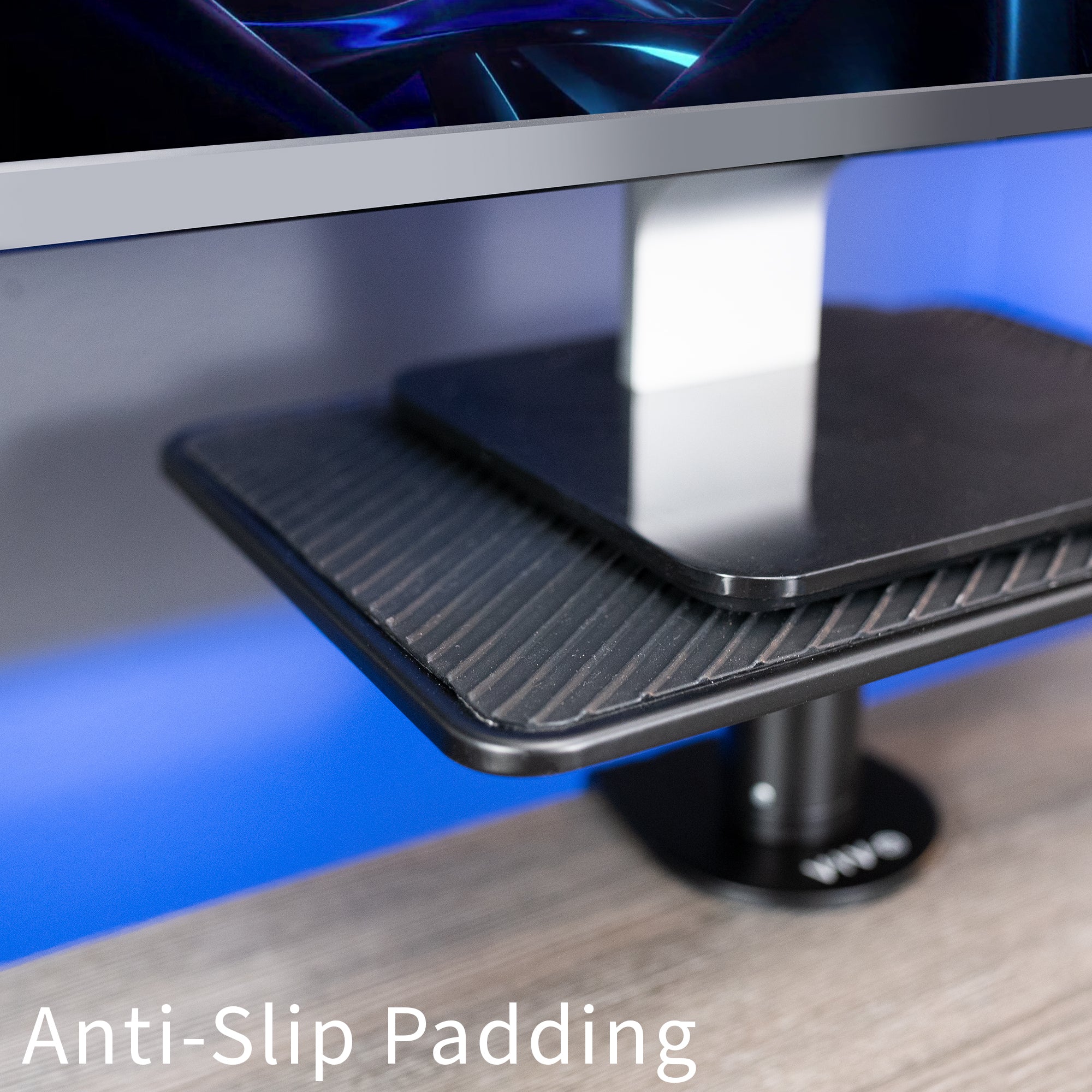 Anti-slip padding on a monitor stand with text 'Anti-Slip Padding' displayed.