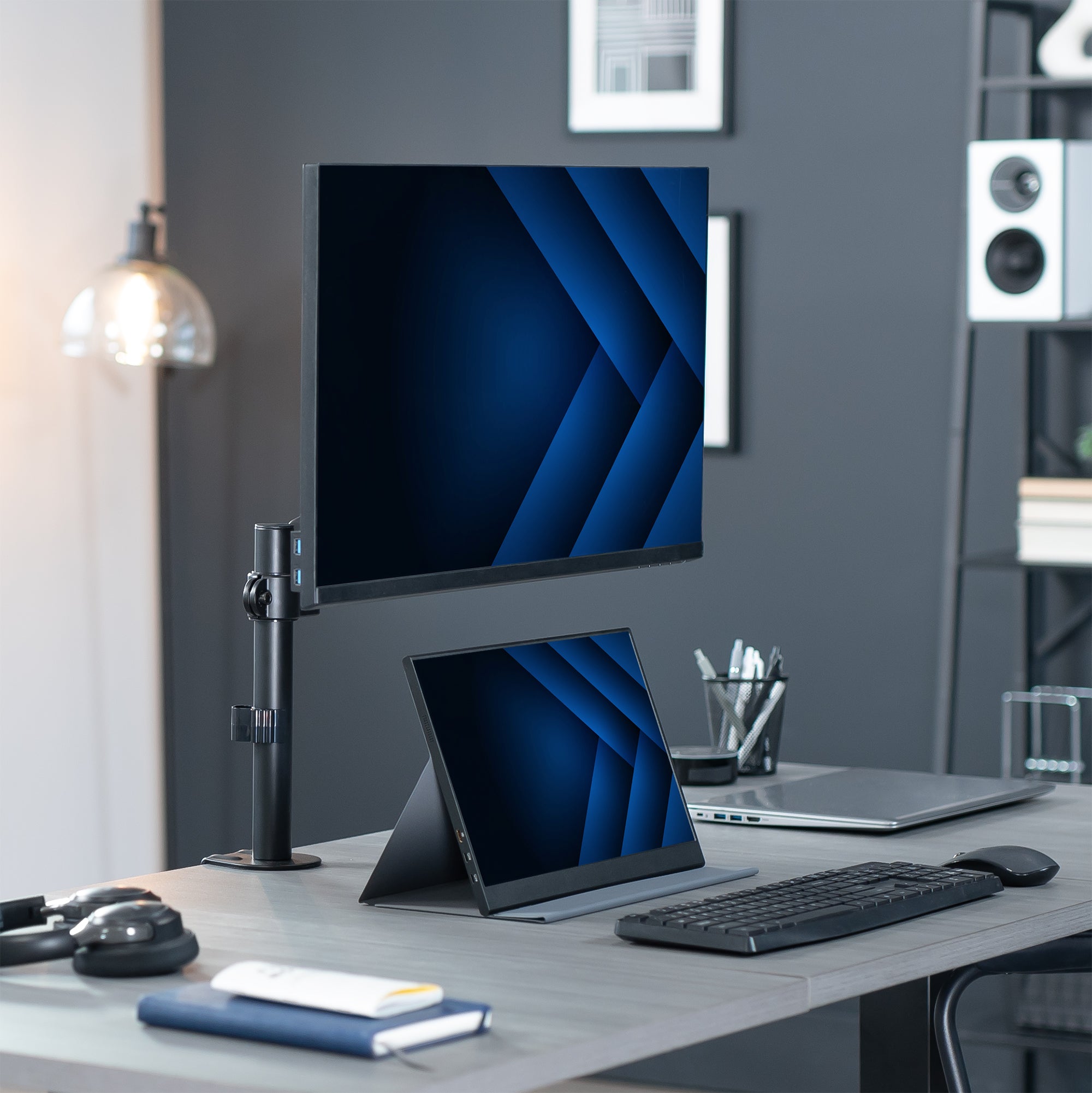 Pneumatic single monitor mount in modern office space