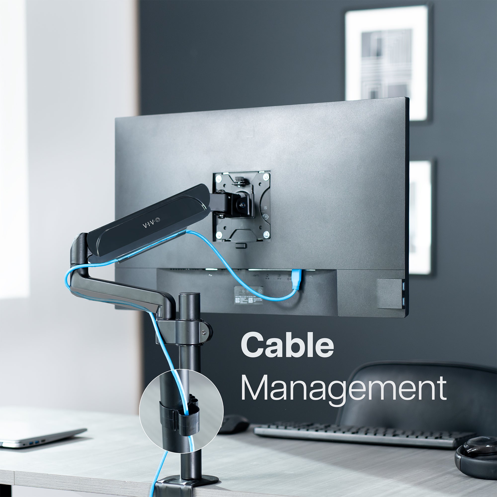 Cable management feature on pneumatic single monitor mount