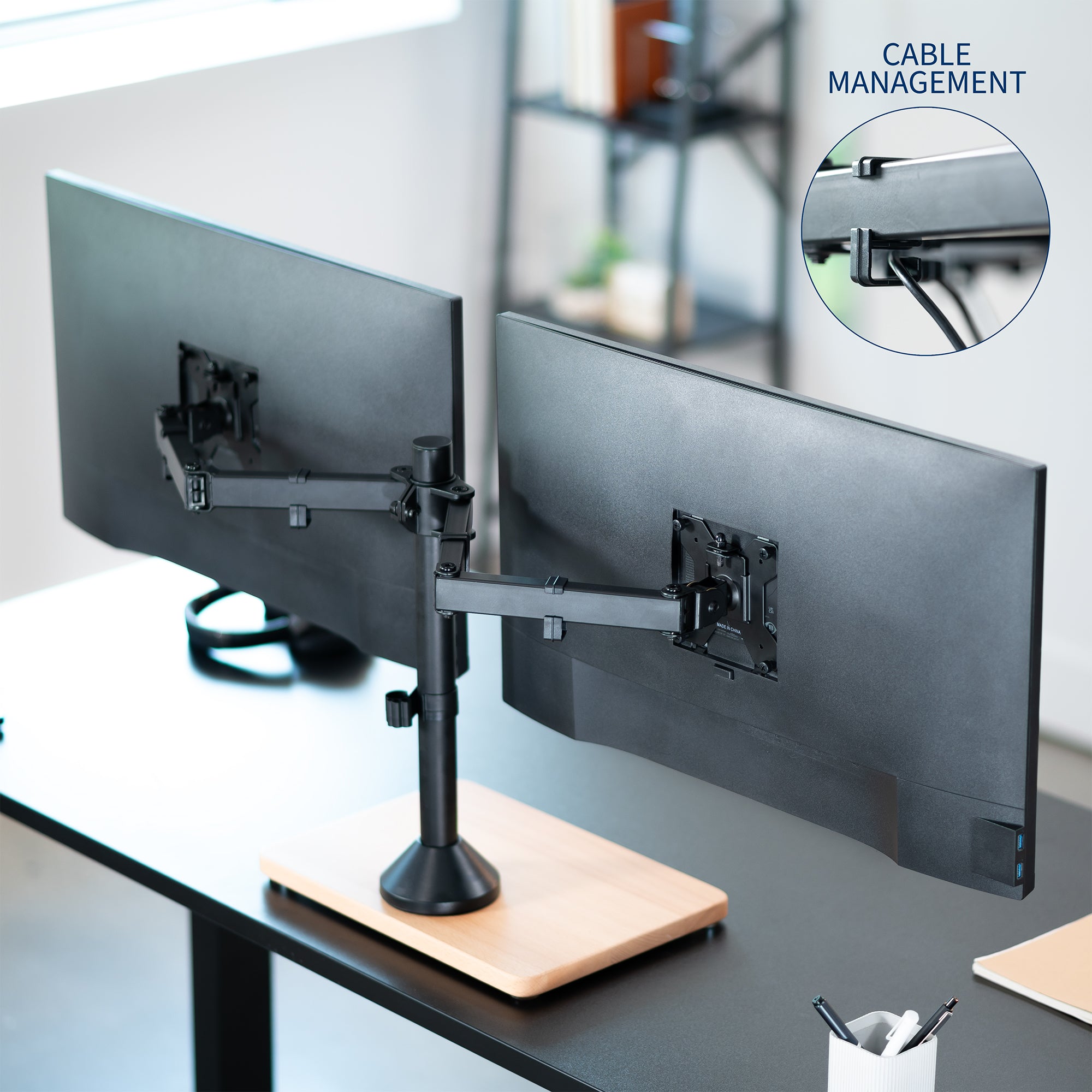 Dual monitor mount desk stand with wooden base. Featuring height adjustment, tilt, swivel, rotation, and built-in cable management.