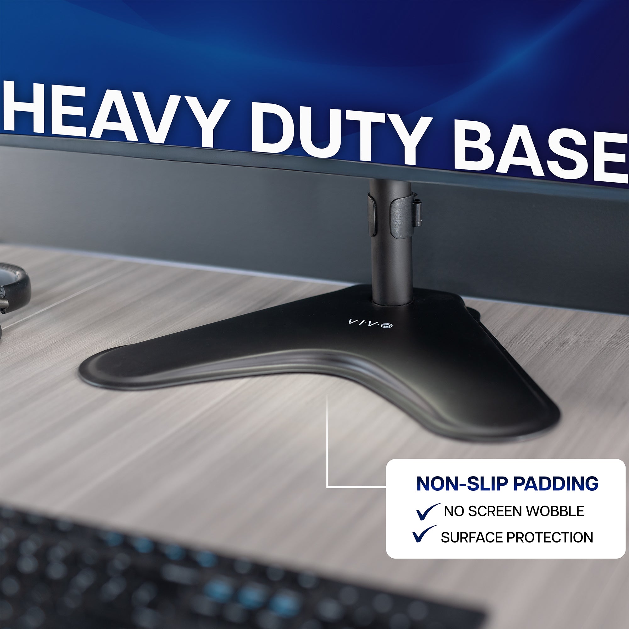 Computer dual monitor stand with a heavy-duty base on a desk, featuring non-slip padding and surface protection.