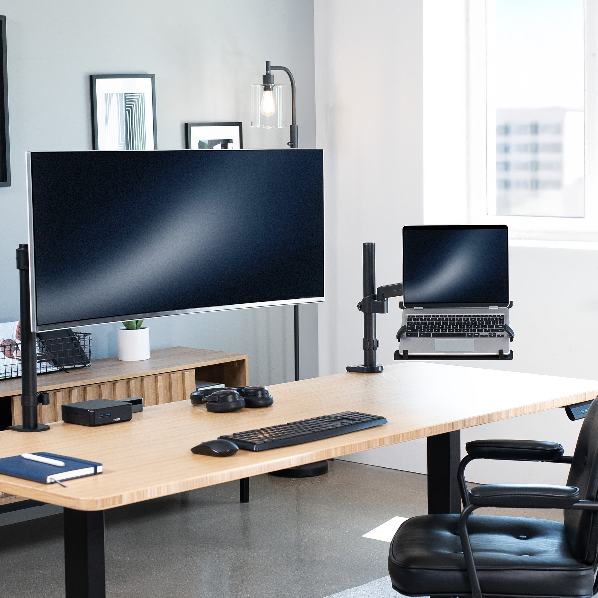 Pneumatic Arm Single Laptop Desk Mount in Office Setting.