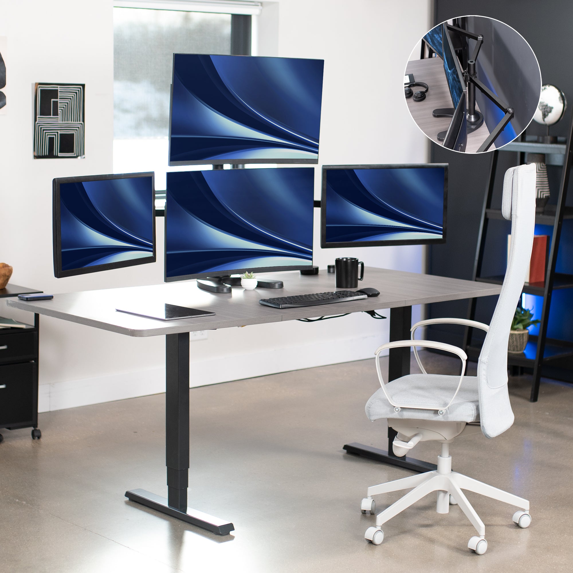 Quad Monitor Desk Stand on desk in office space.
