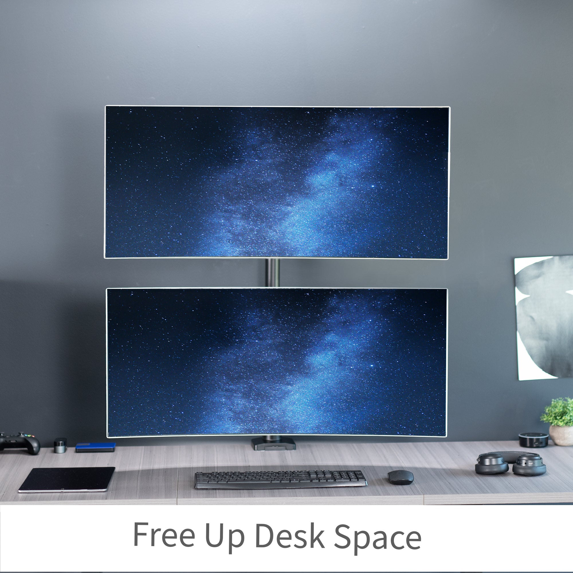 Stacked vertical dual monitor ultrawide desk mount with extending arms. Height adjustable with tilt, swivel, and integrated cable management.