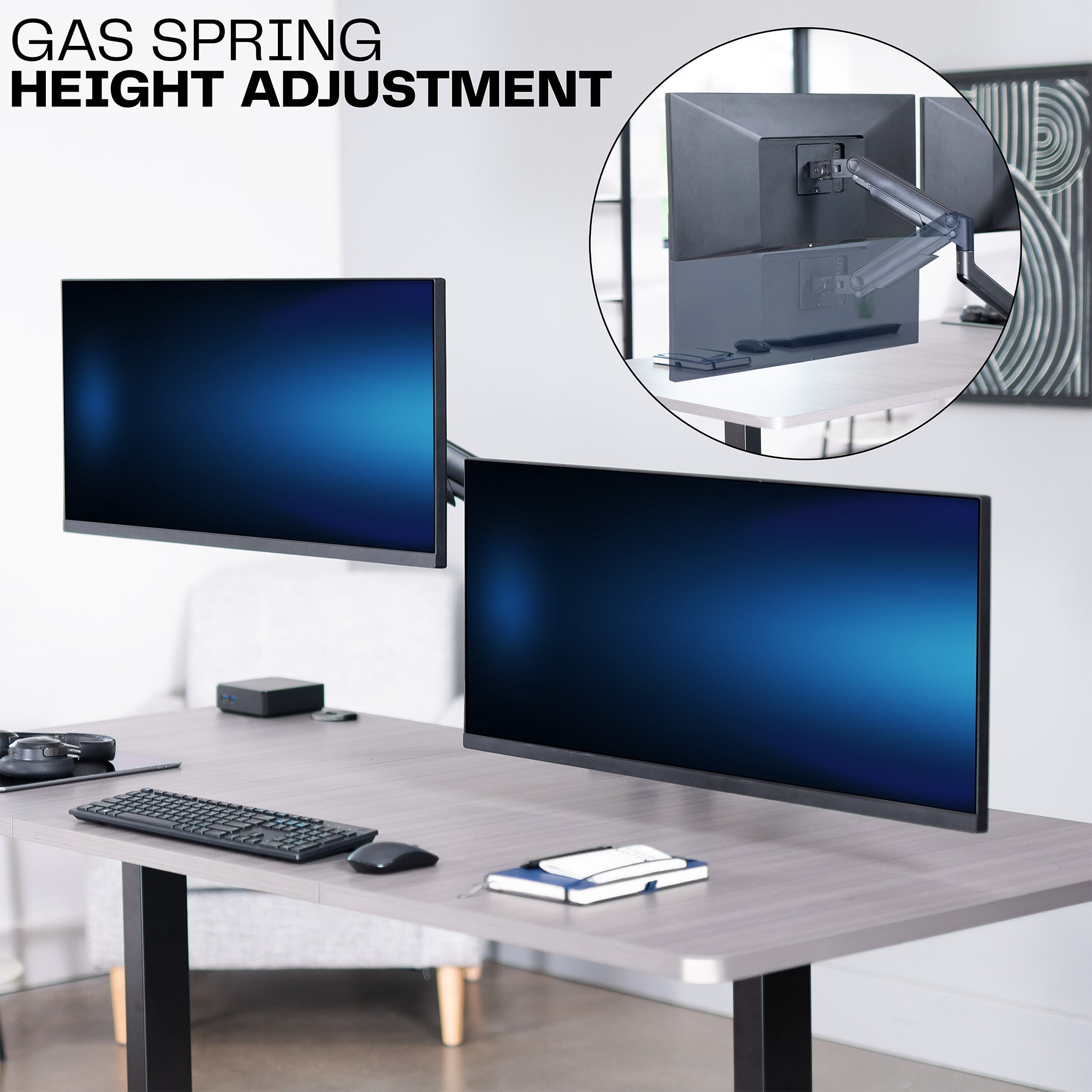A dual monitor desk mount with pneumatic arms and a gas spring for height adjustments.