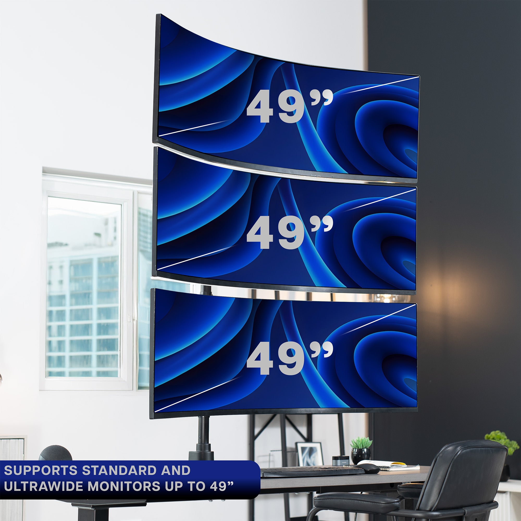 Three 49-inch monitors stacked on a desk with a home office background.