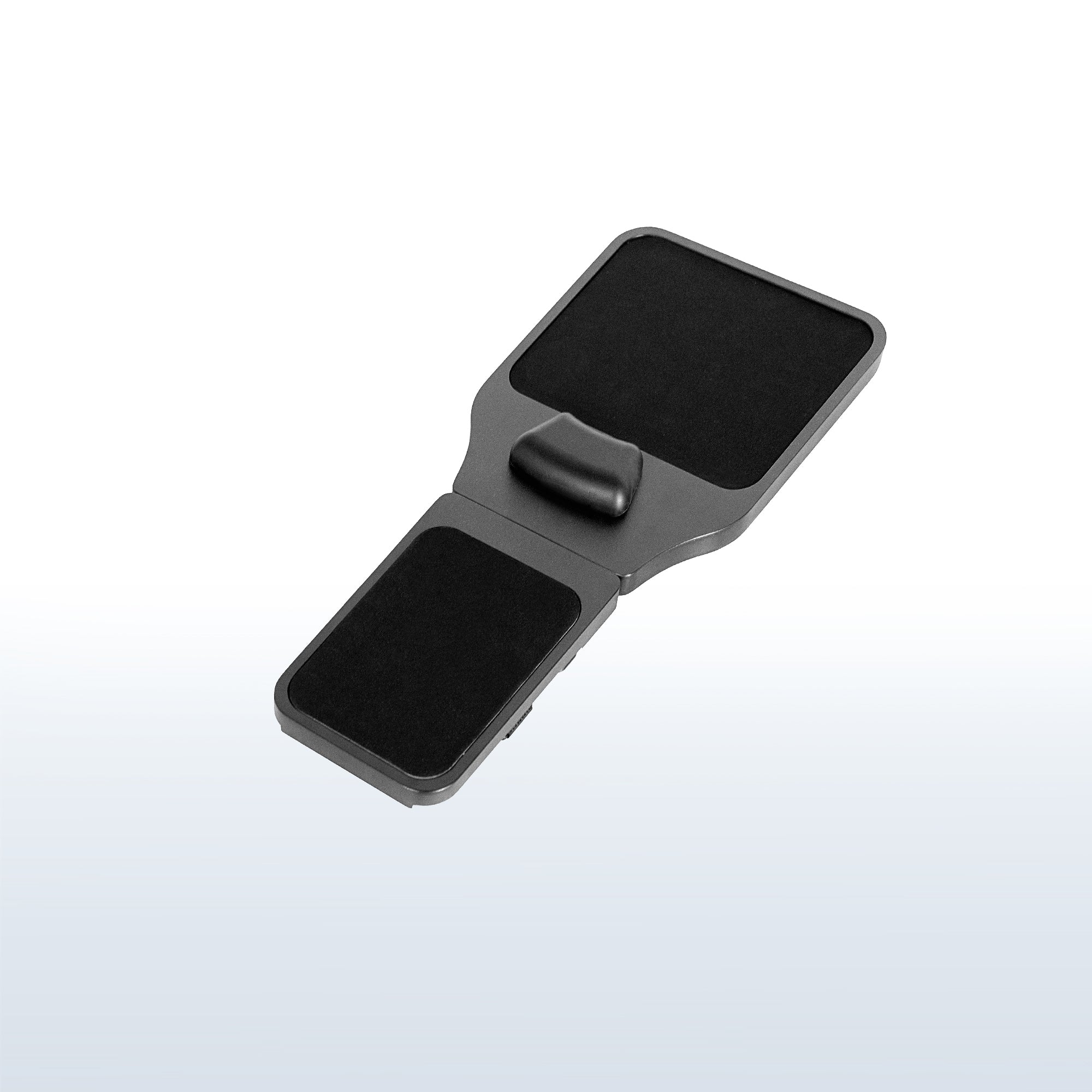 Strap on chair armrest with mouse pad.