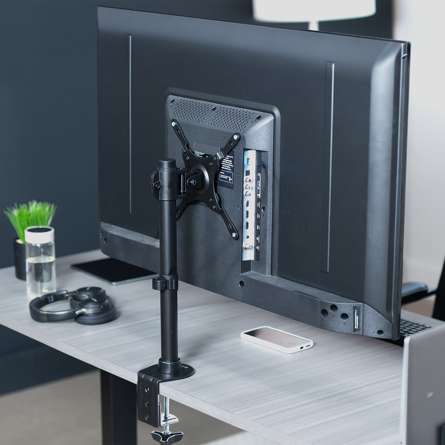 Sturdy Height Adjustable Single Monitor Desk Mount in Office Space