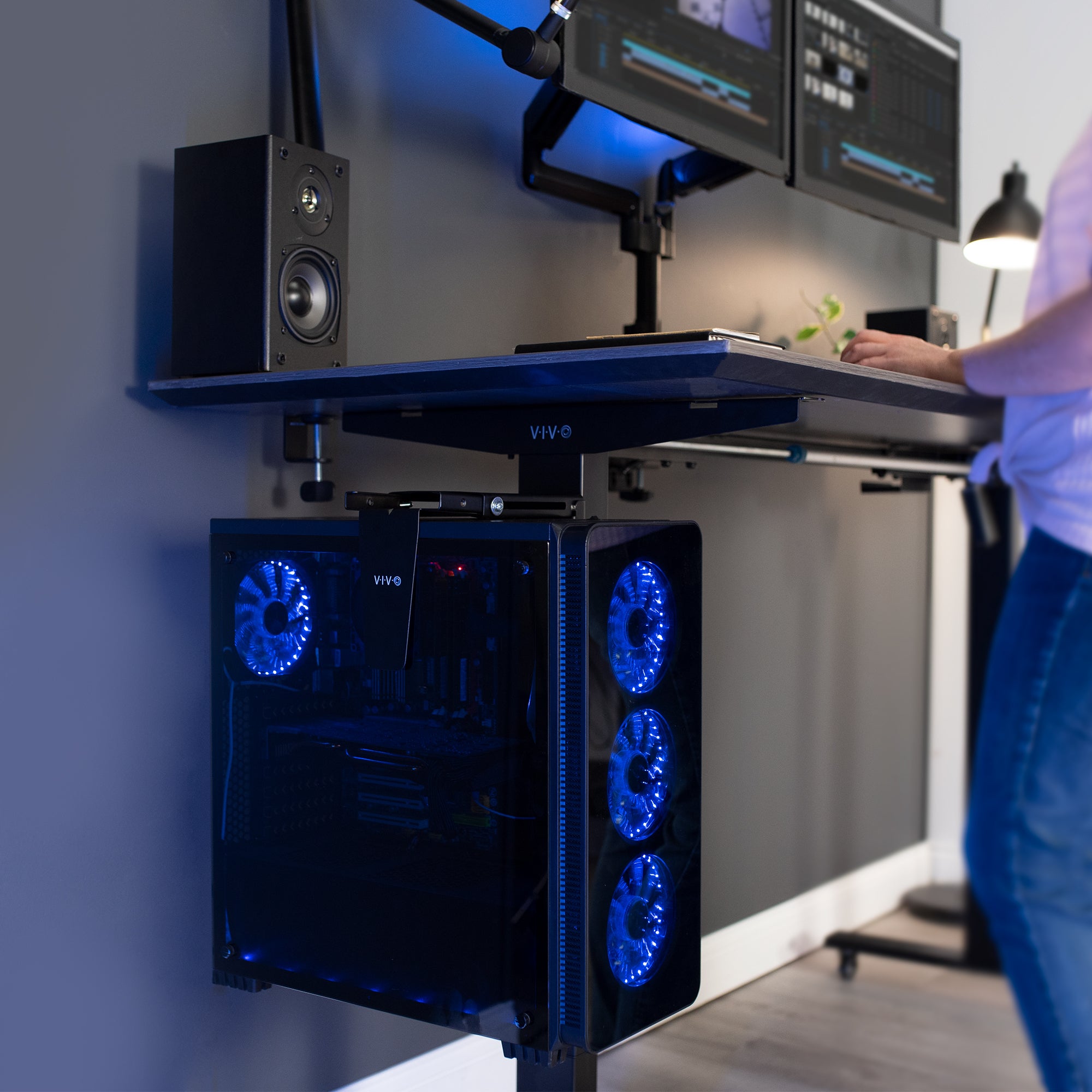 Clamp-on PC mount secures to desk legs for convenient placement.