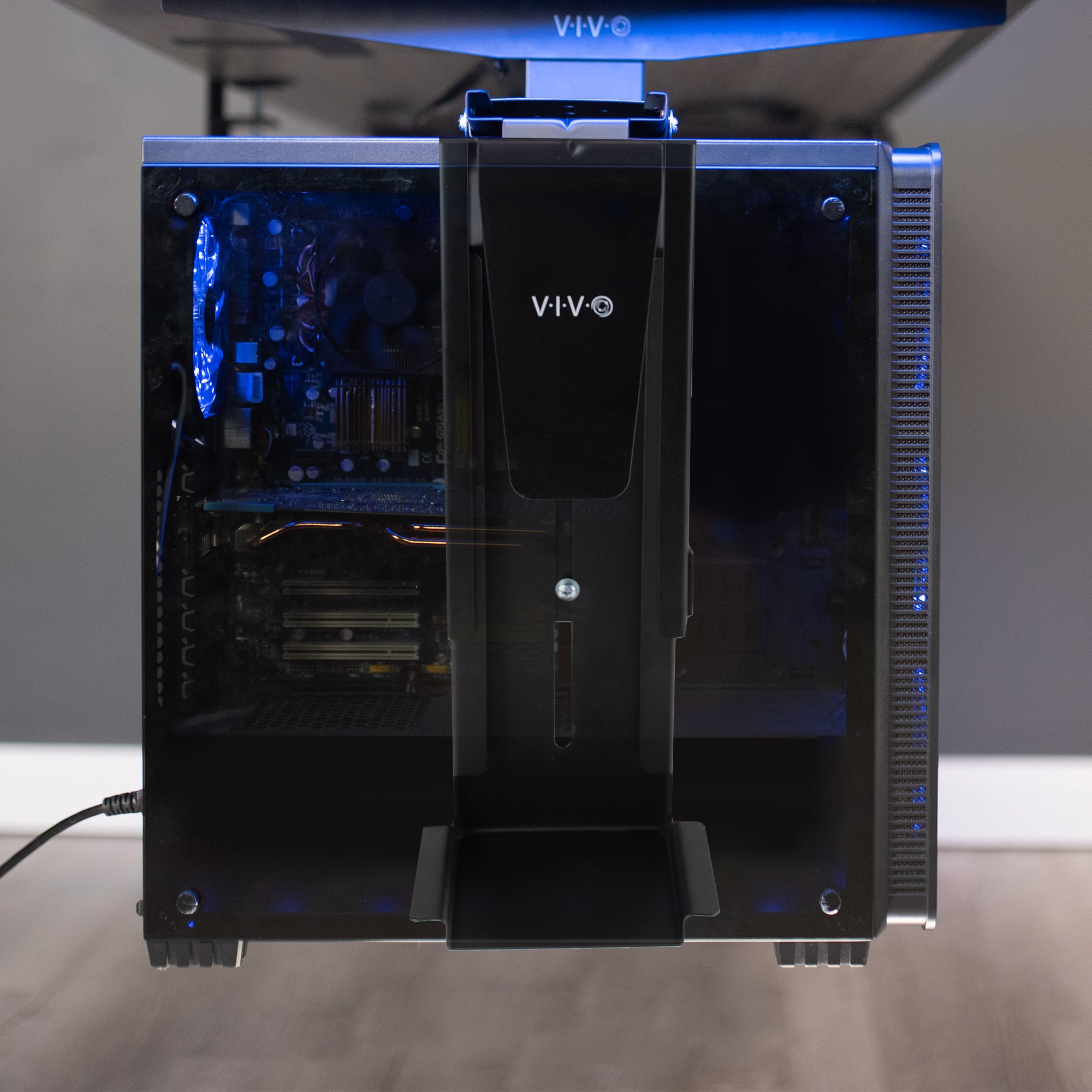 Clamp-on PC mount secures to desk legs for convenient placement.