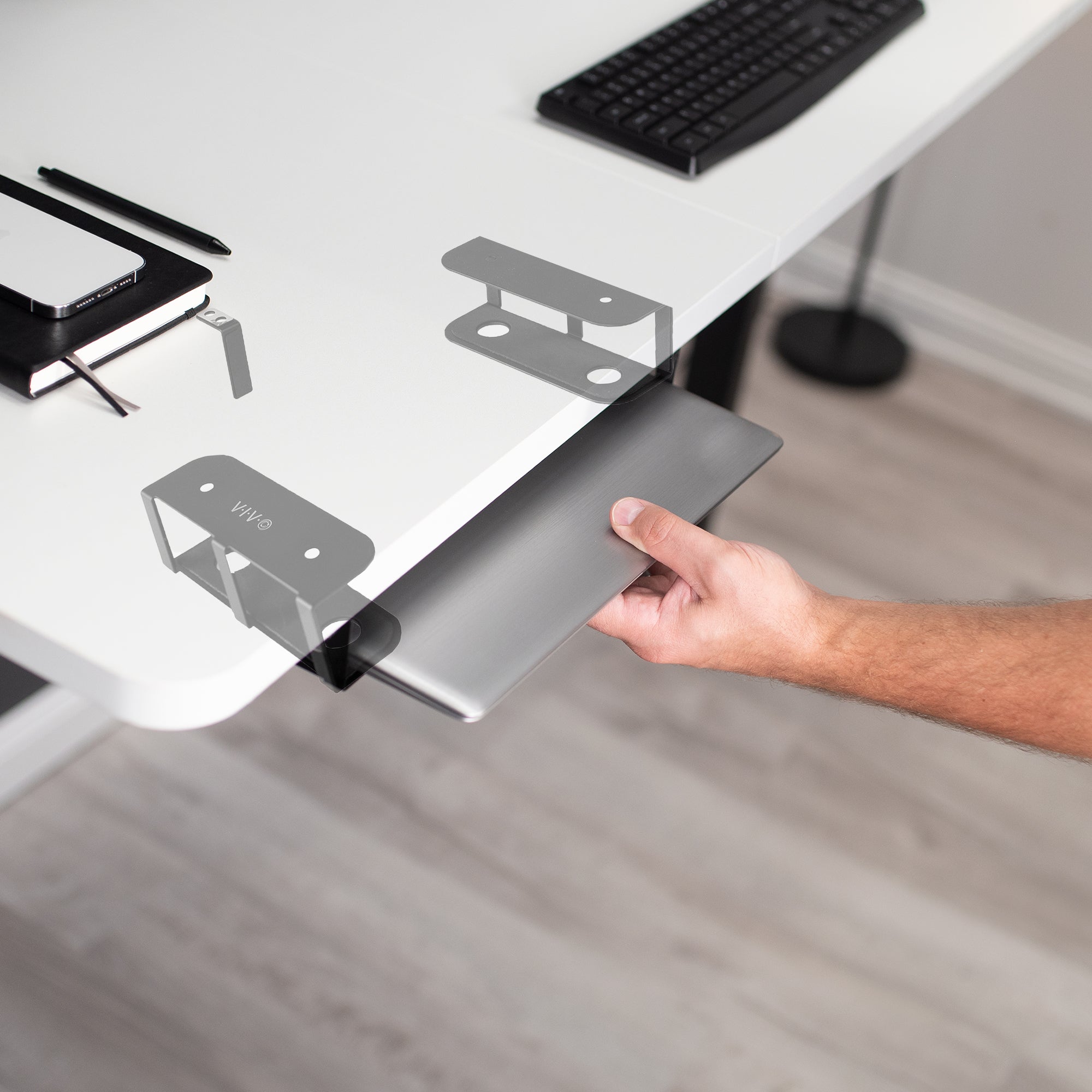 Easy access to the laptop while stored underneath the desktop.