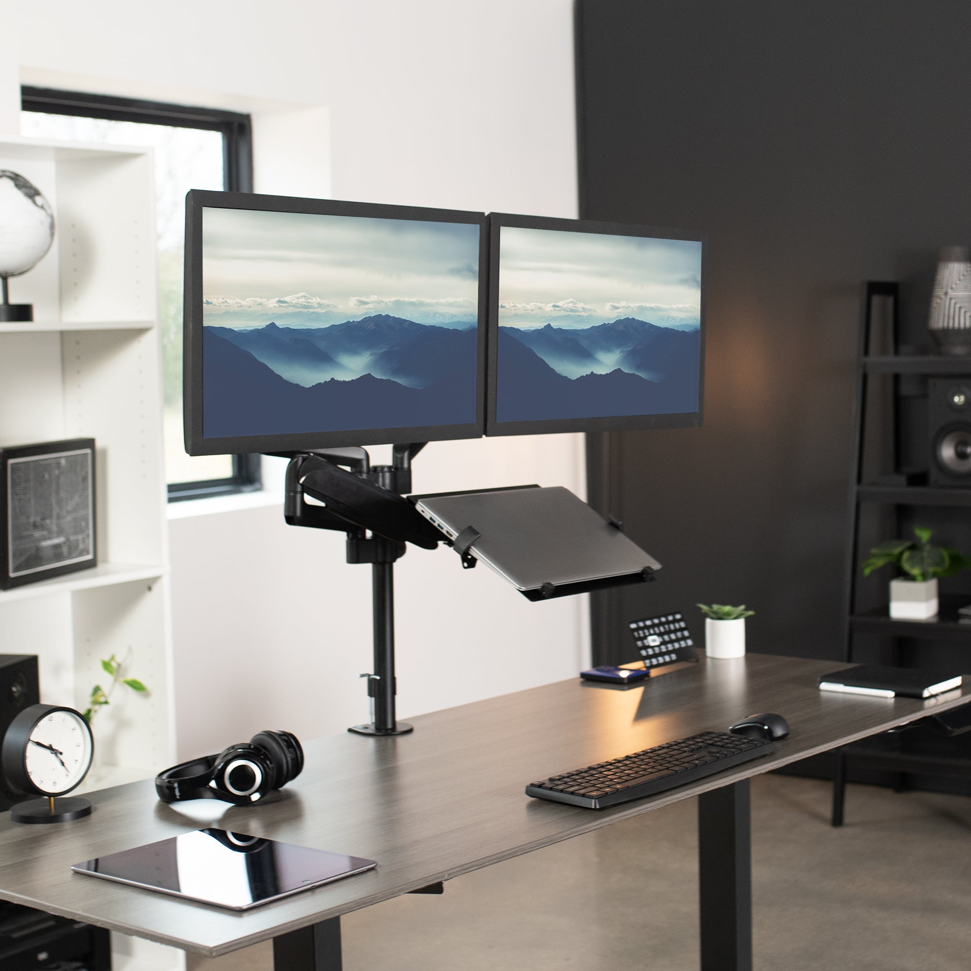 Pneumatic arm dual monitor and laptop desk mount that elevates your screens to a comfortable viewing height.
